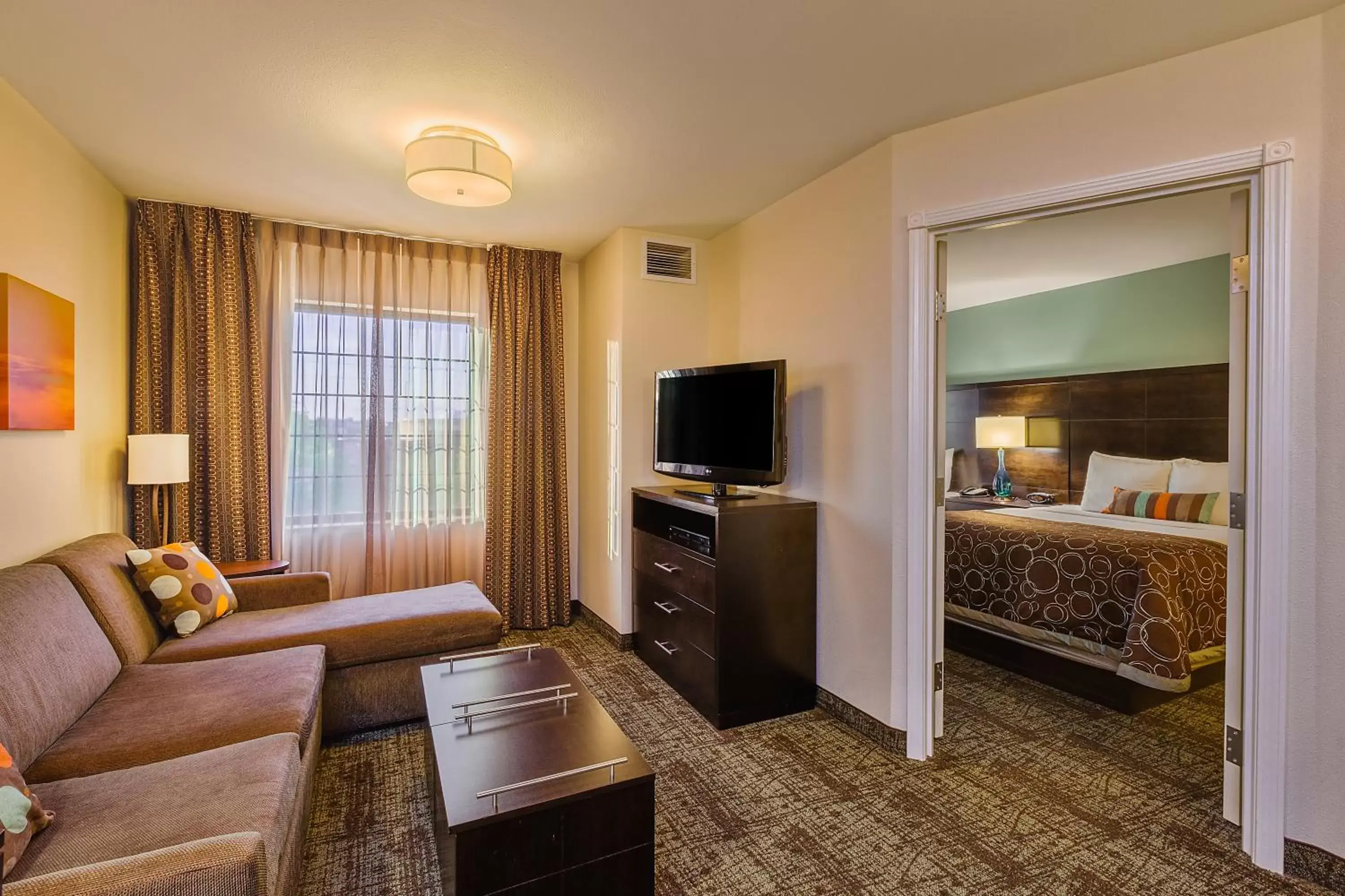 Photo of the whole room, Seating Area in Staybridge Suites Bismarck, an IHG Hotel