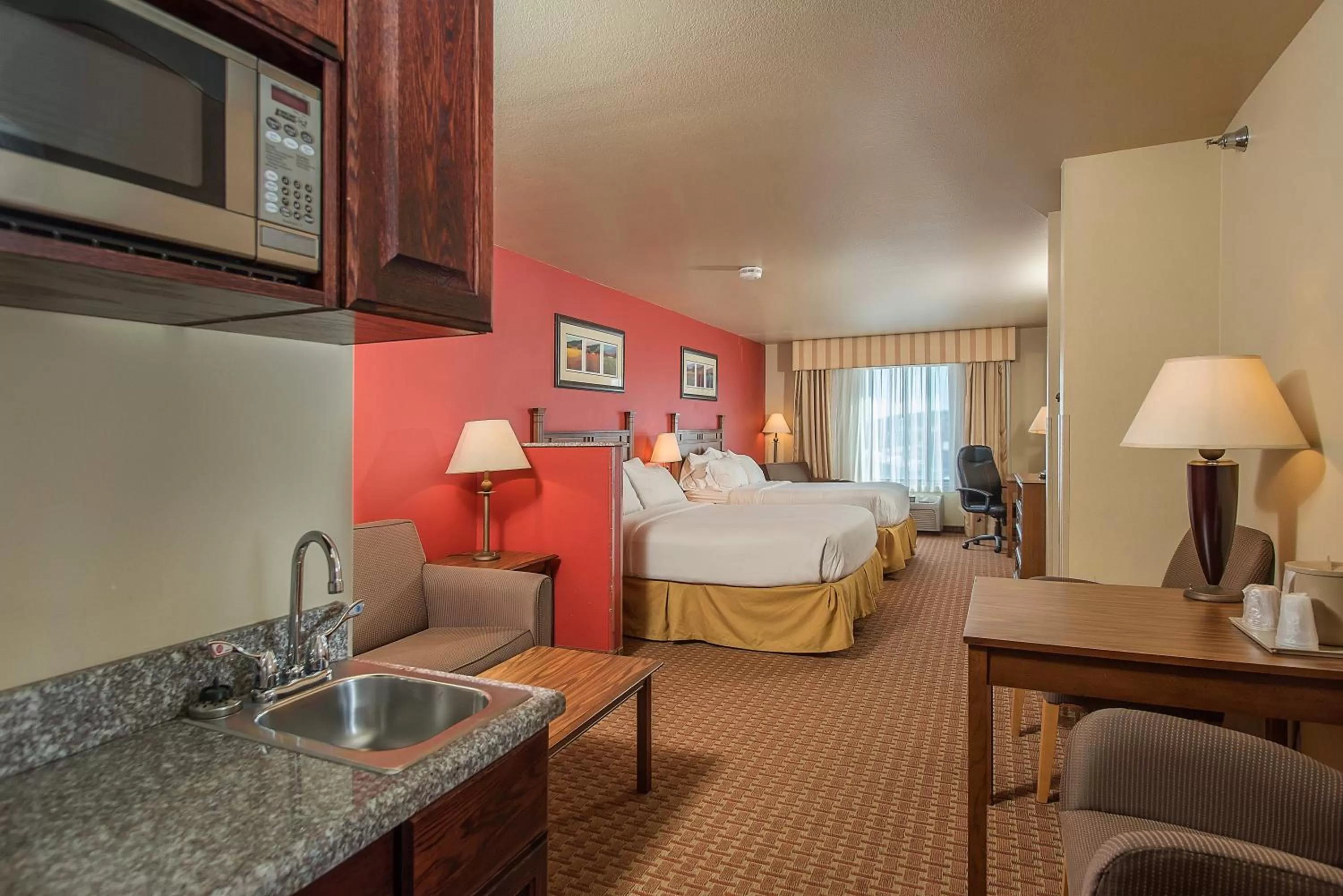Bed in Baymont Inn & Suites by Wyndham Sturgis