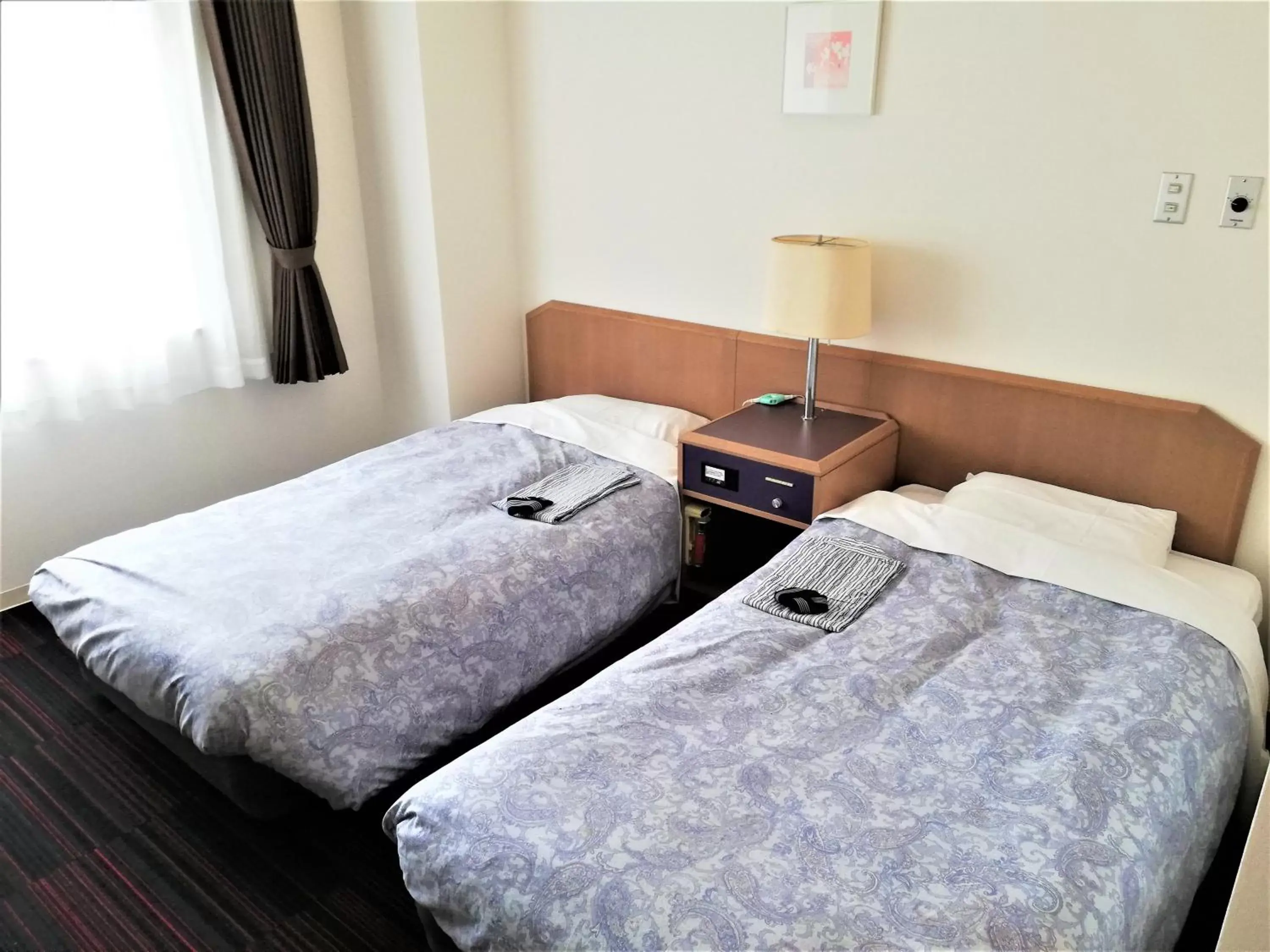 Bed in Hotel Tetora Spirit Sapporo