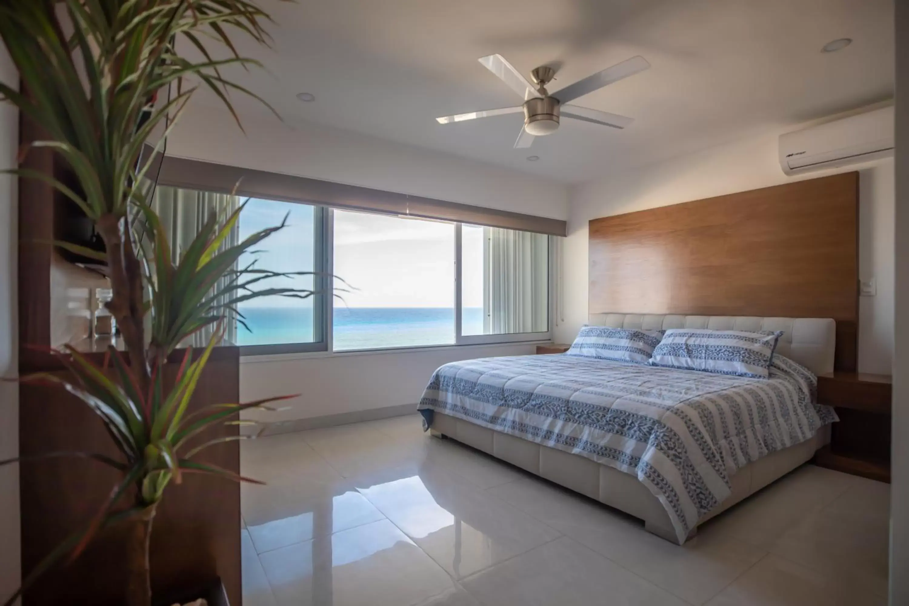 Bed in Beachfront Penthouses by LivIN Cancun