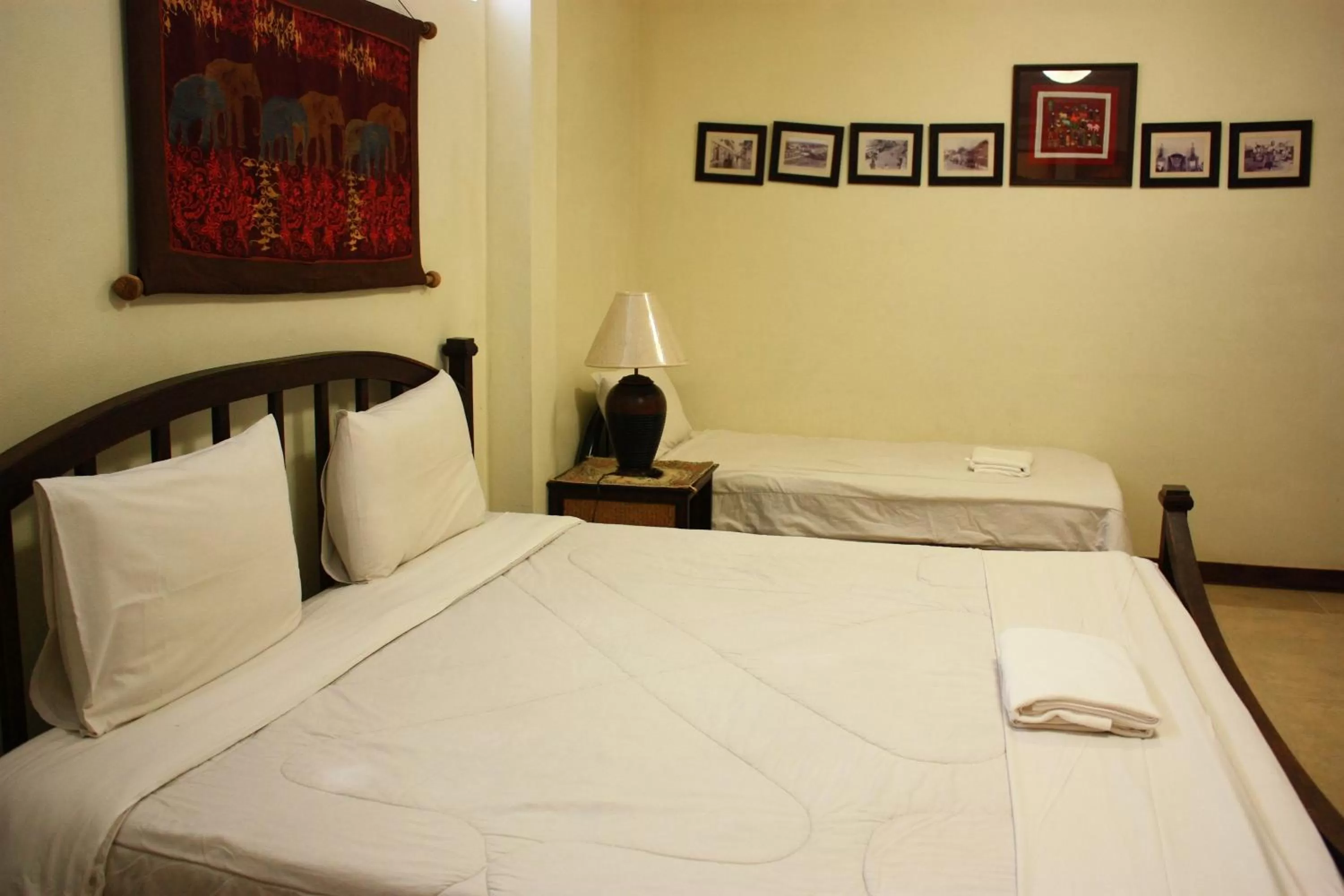 Bed in โรงแรมตีฆ้อง - Tri Gong Hotel