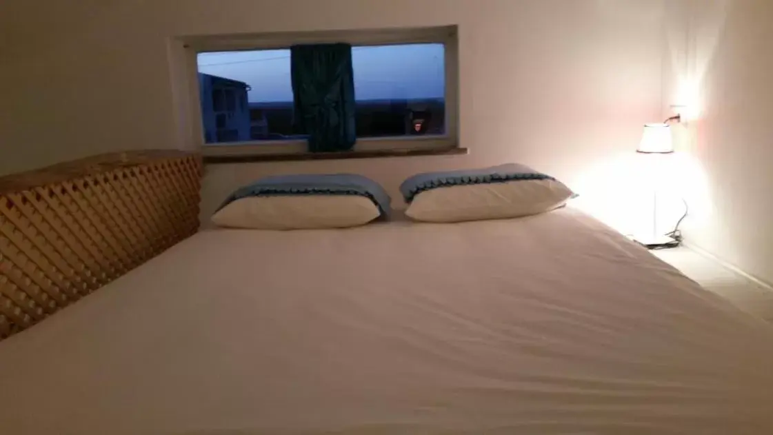 Bed in PuraVida Divehouse