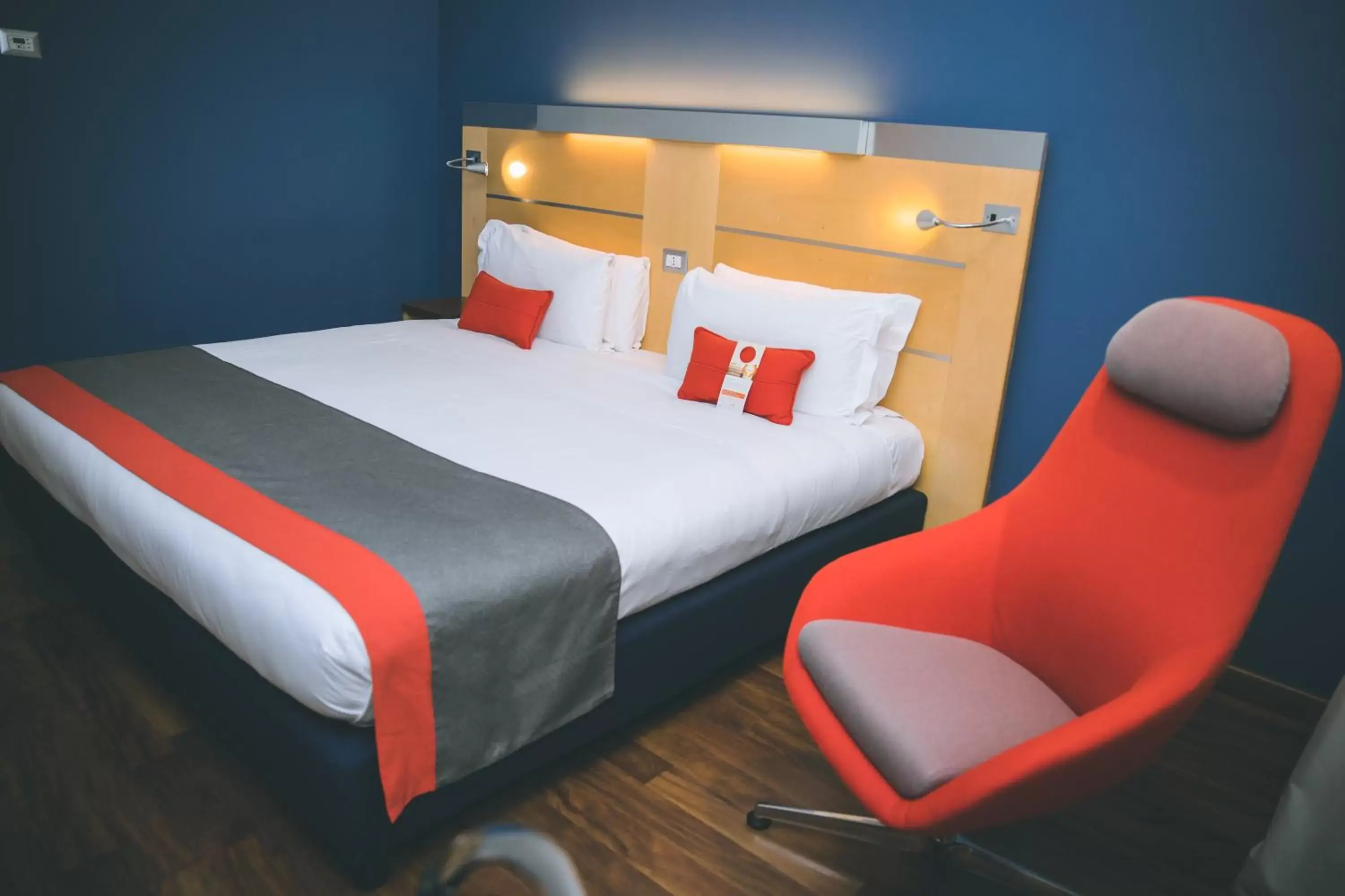 Bed in Holiday Inn Express Milan-Malpensa Airport, an IHG Hotel