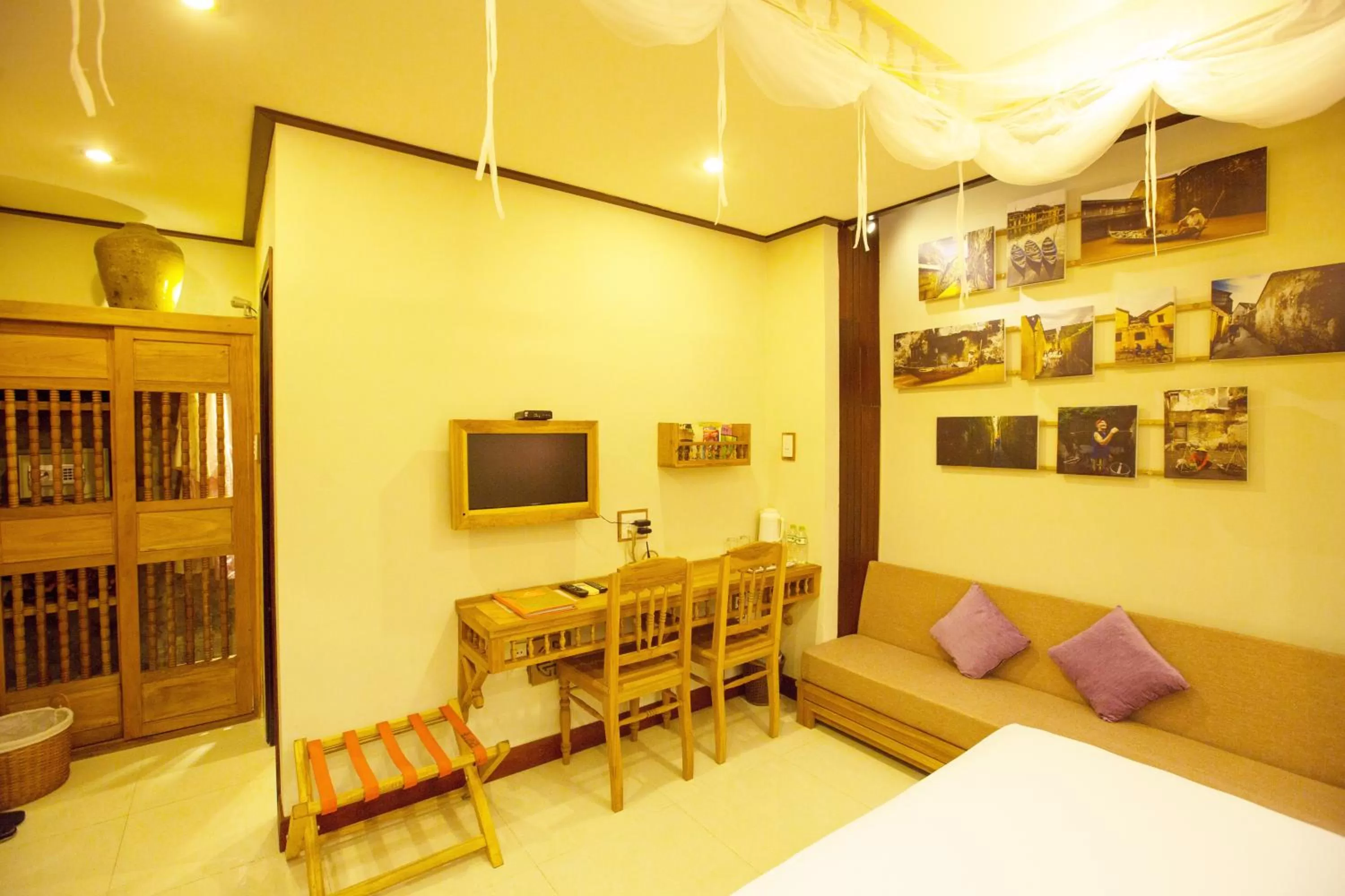 Seating area, Bed in Hoi An Pho Library Hotel