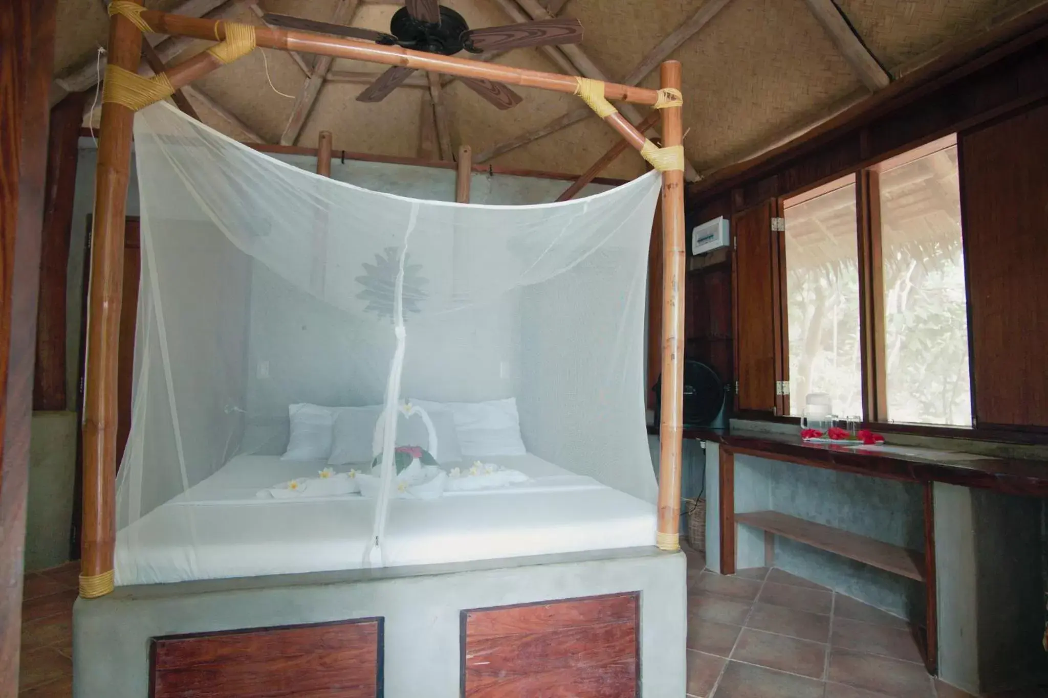 Bed in Sangat Island Dive Resort