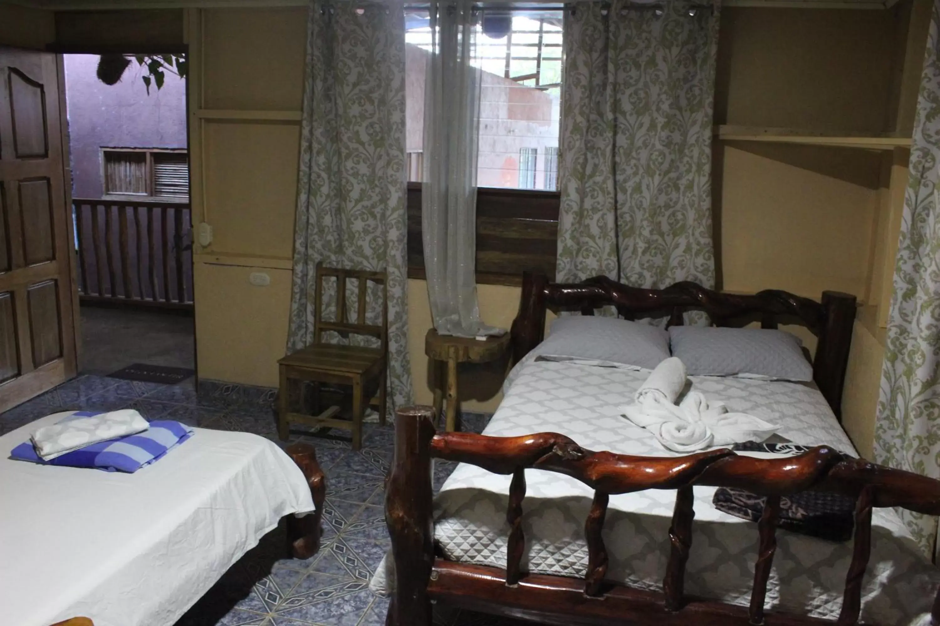 Bed in Iguanitas Lodge