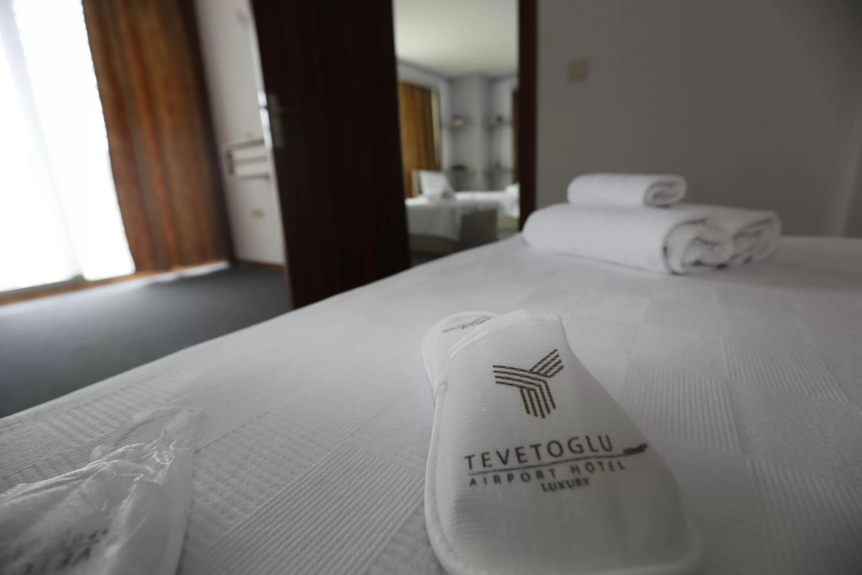 Bed in TEVETOGLU HOTEL