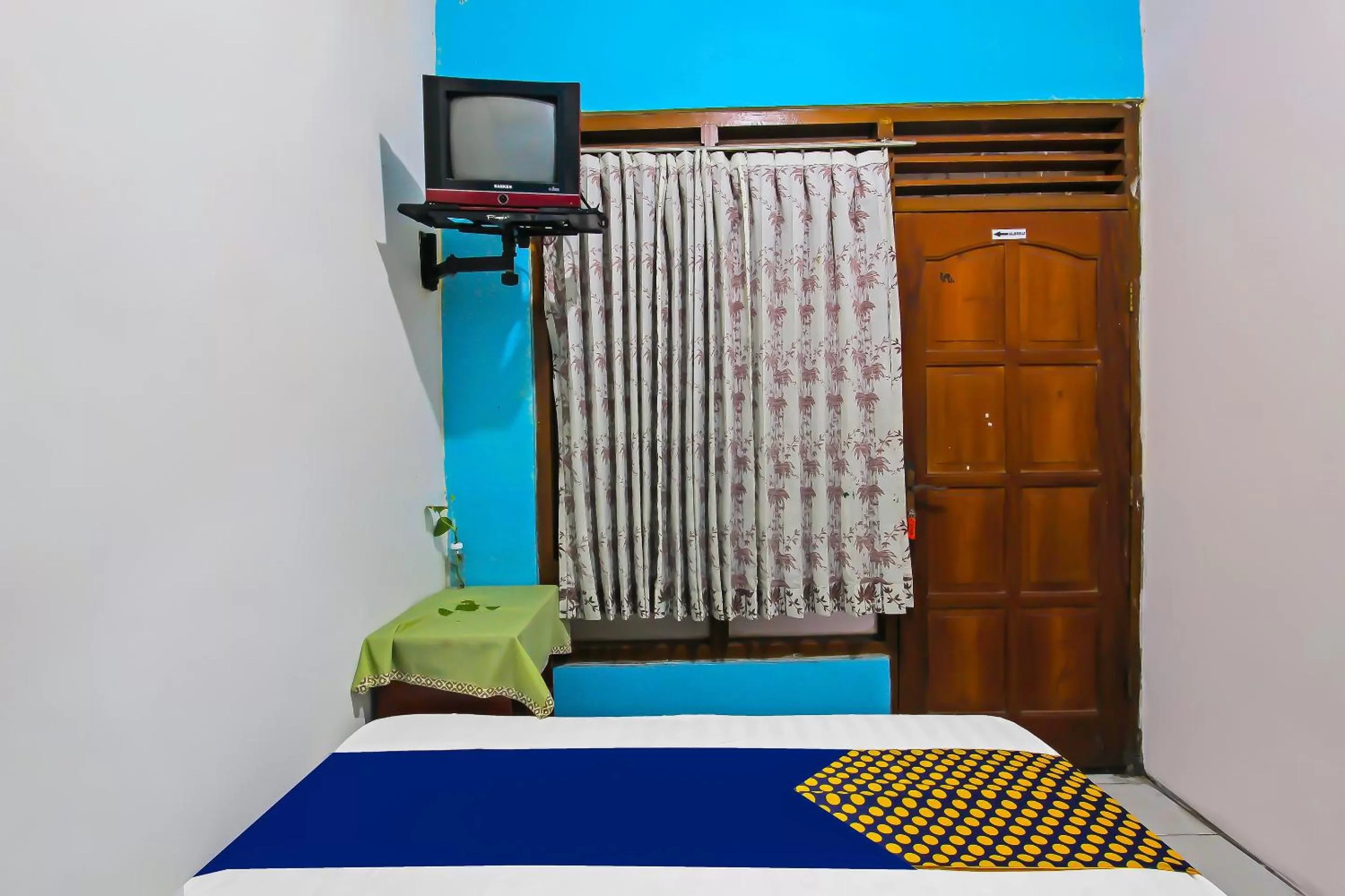 Bedroom, TV/Entertainment Center in SPOT ON 91911 Rejeki Homestay Syariah Malioboro