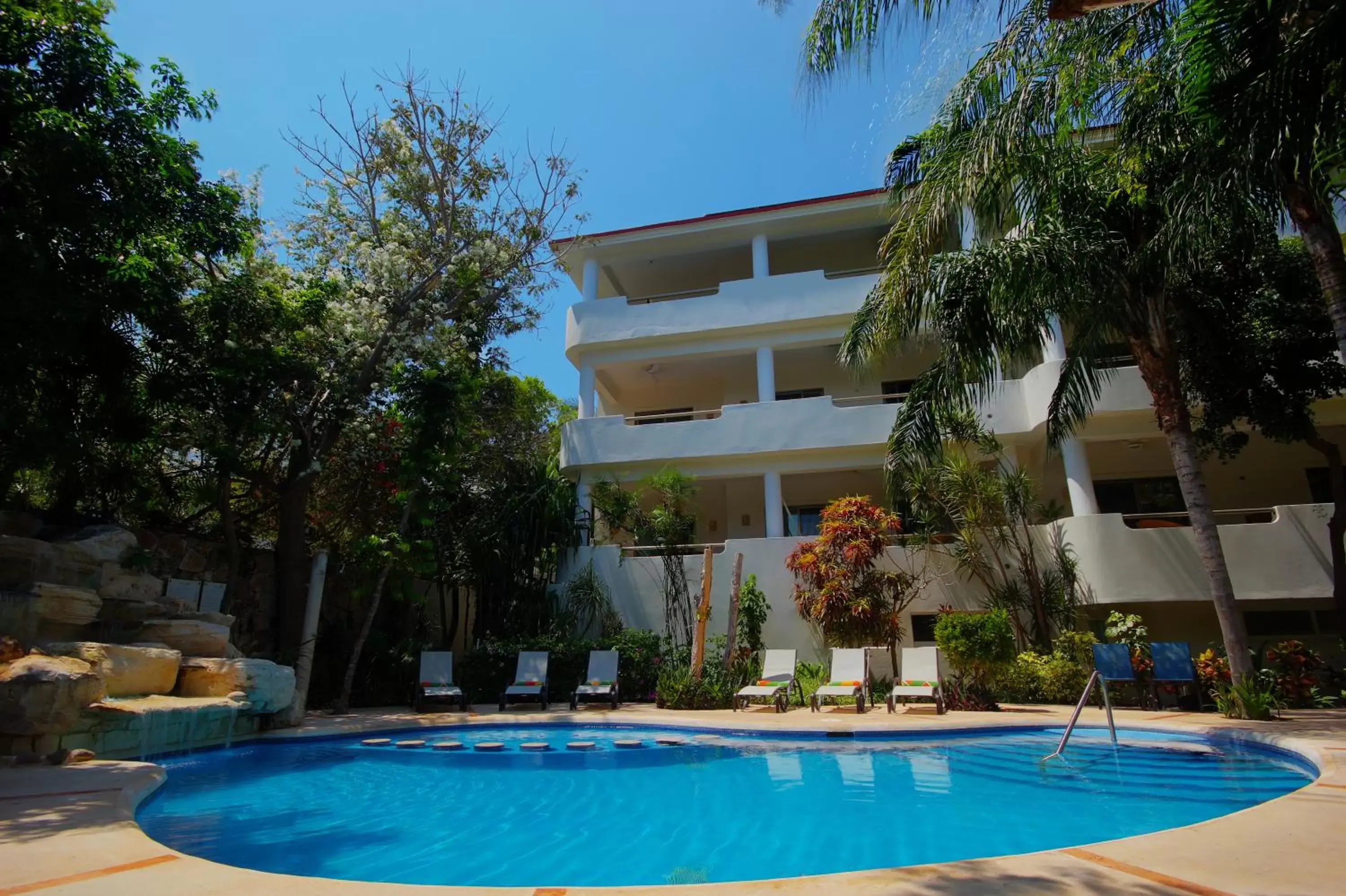 Swimming pool, Property Building in Riviera Maya Suites