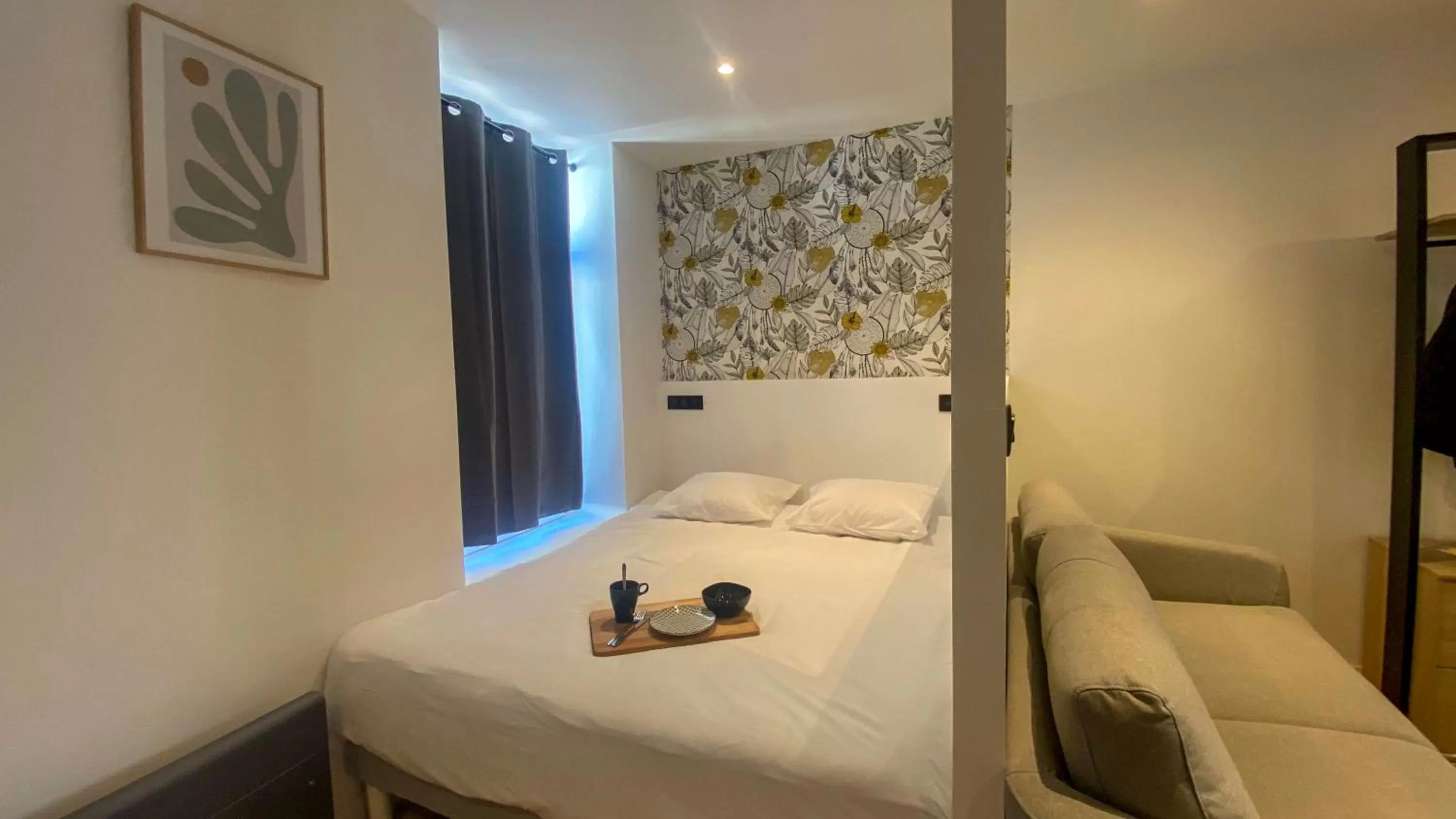 Bed in Le Bras d'or Apparts et Spa