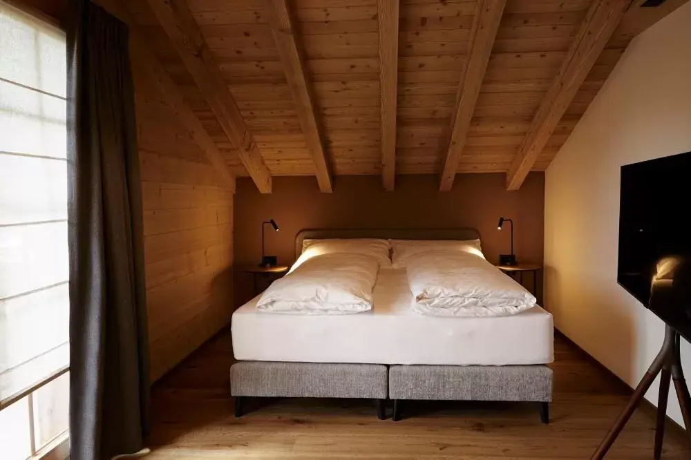 Bed in Hotel Alpenland