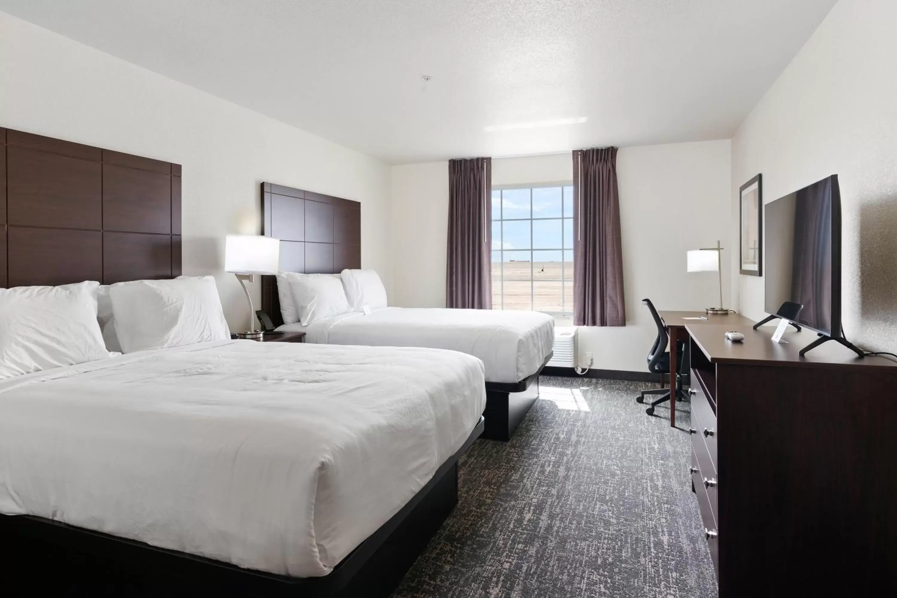 Bed in Cobblestone Inn & Suites - Yuma