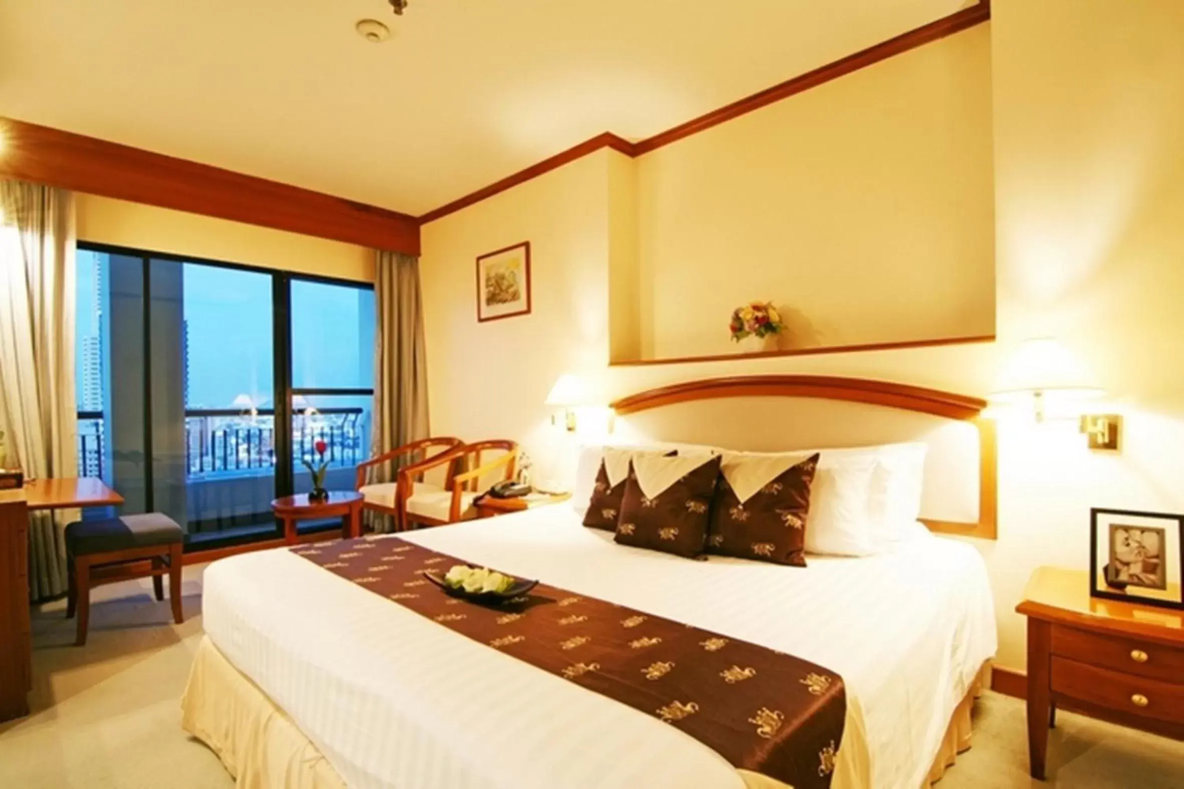 Bed in Grand Diamond Suites Hotel