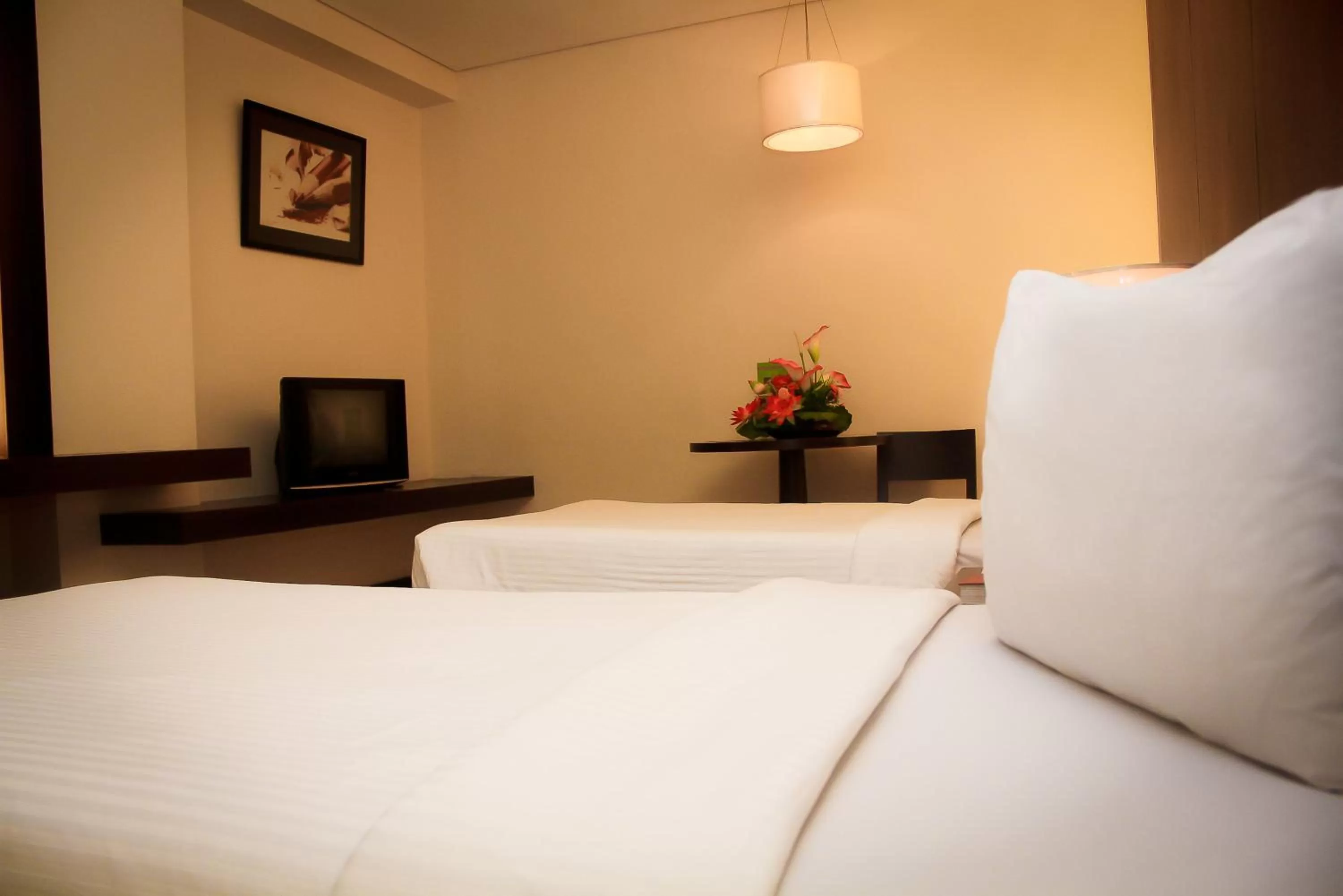 Bed in CityState Tower Hotel