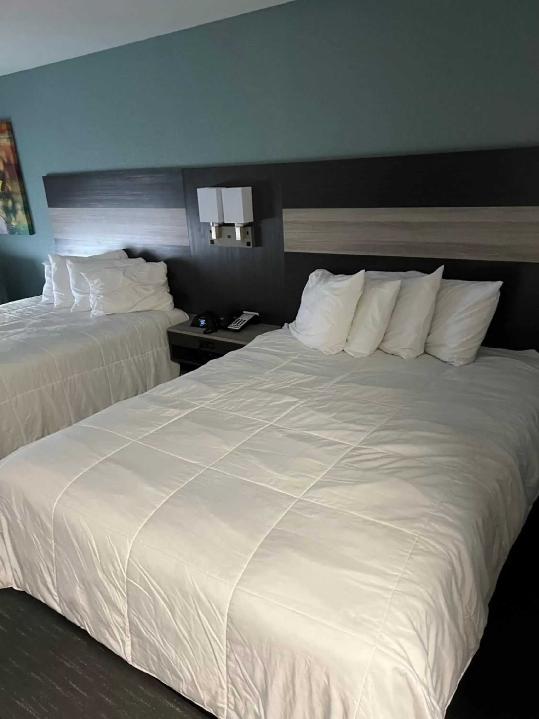 Bed in Prime Inn & Suites Poteau