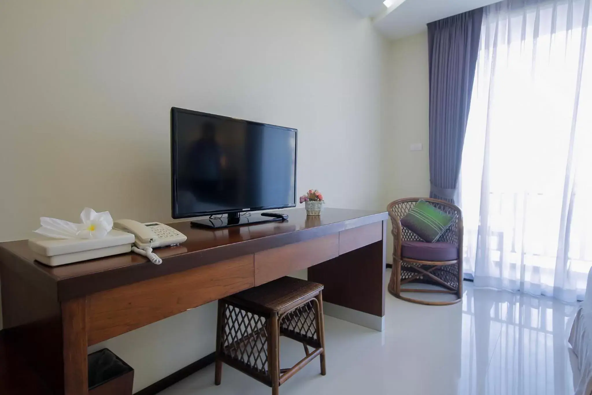 TV and multimedia, TV/Entertainment Center in Baan Nilrath Hotel - SHA Extra Plus