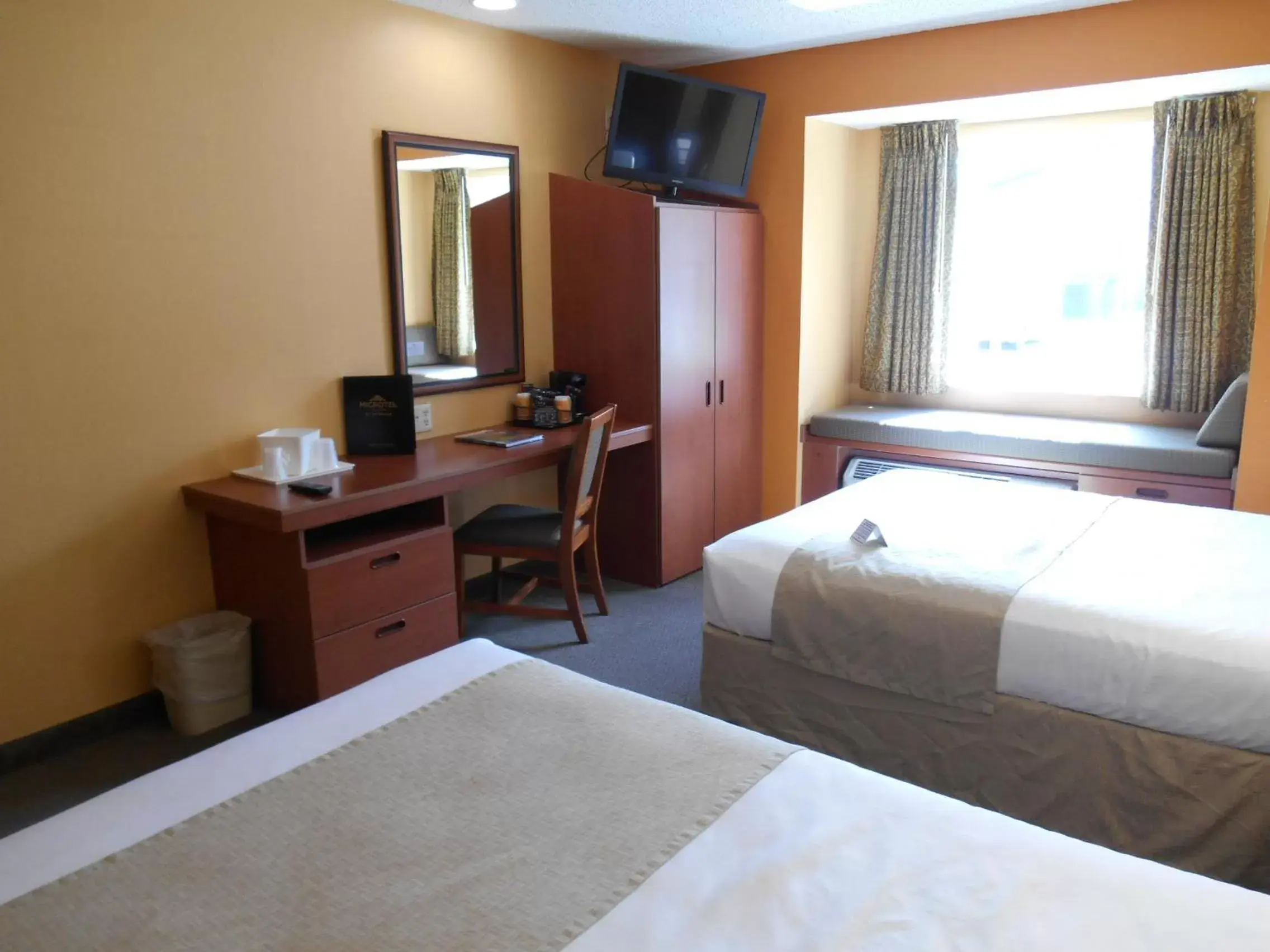 Bedroom, TV/Entertainment Center in Microtel Inn & Suites by Wyndham Cherokee