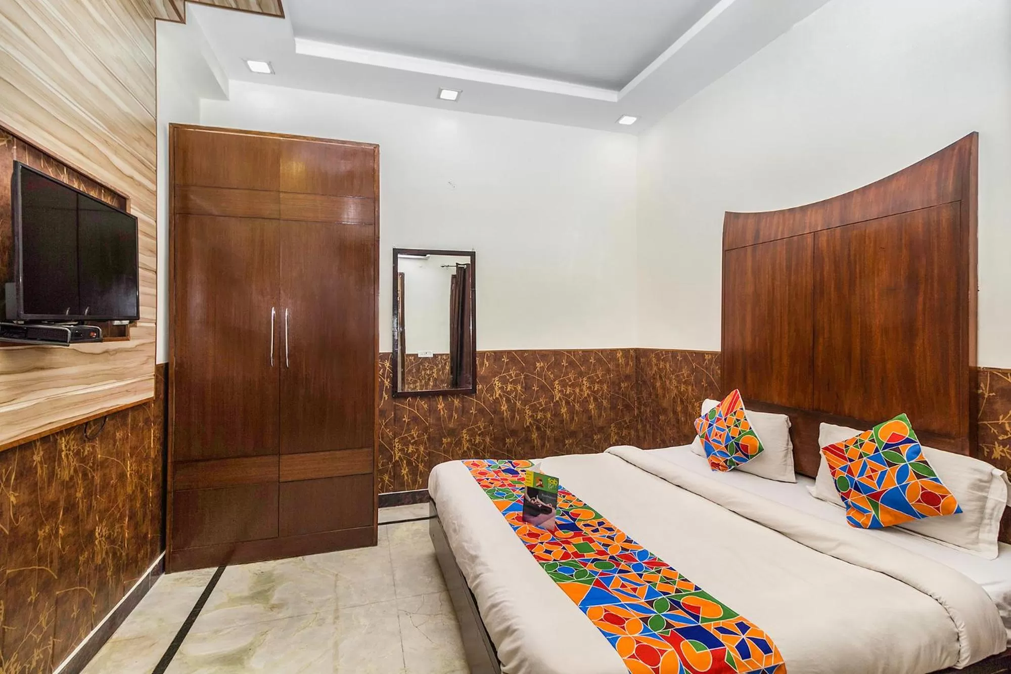 Bed in FabHotel Jindal Palace