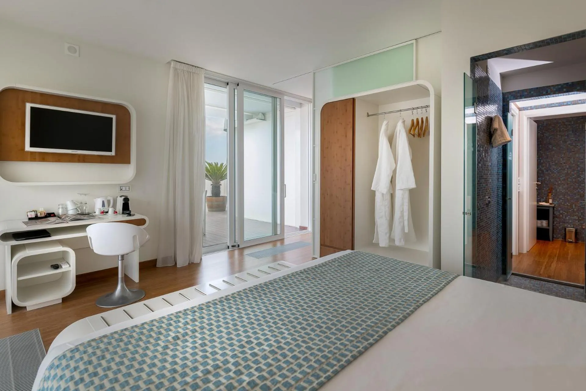 Bed in T-Suite Hotel