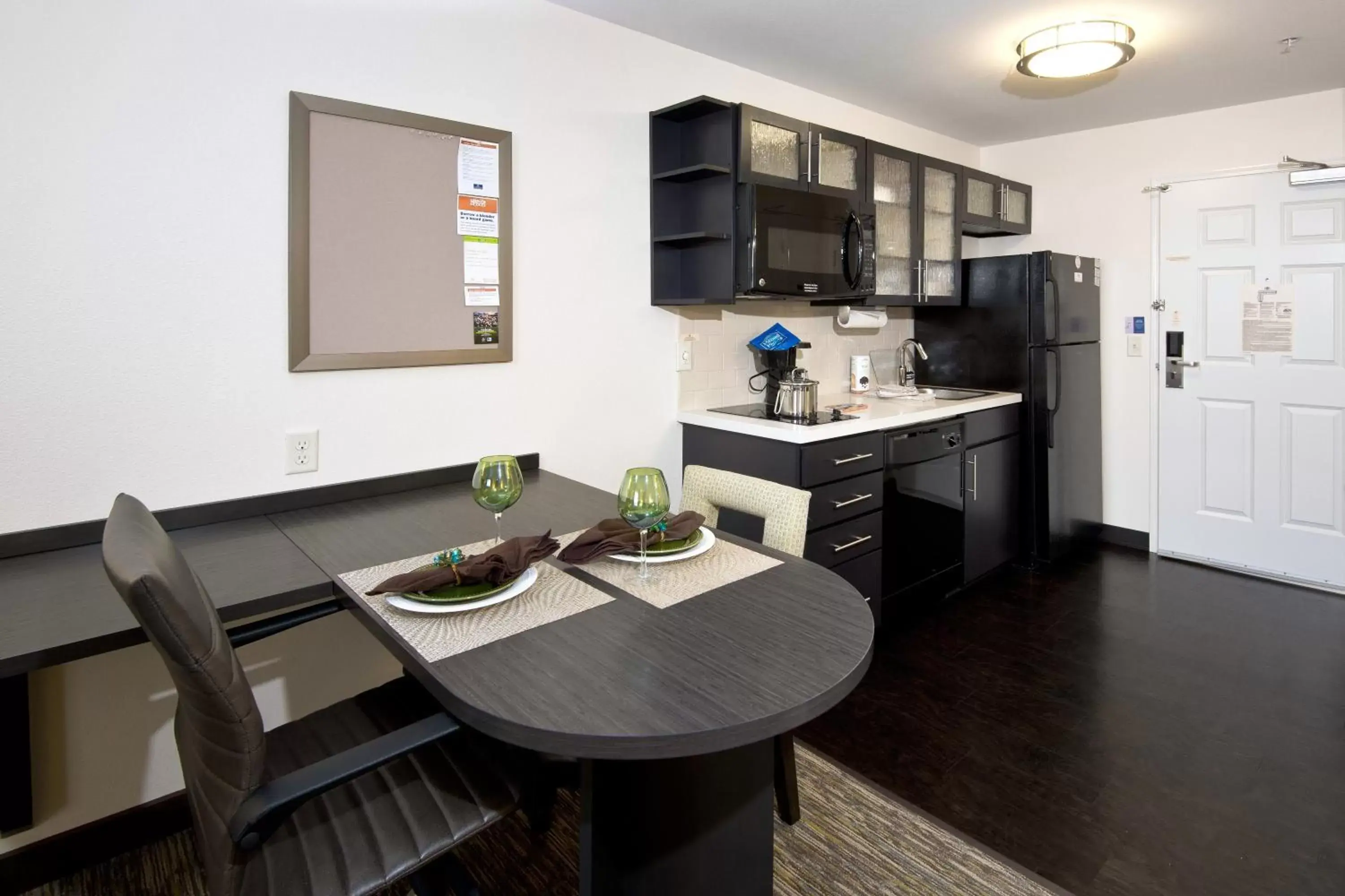 Photo of the whole room, Kitchen/Kitchenette in Candlewood Suites Greeley, an IHG Hotel