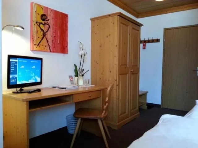 Photo of the whole room, TV/Entertainment Center in Sonnegg Hotel