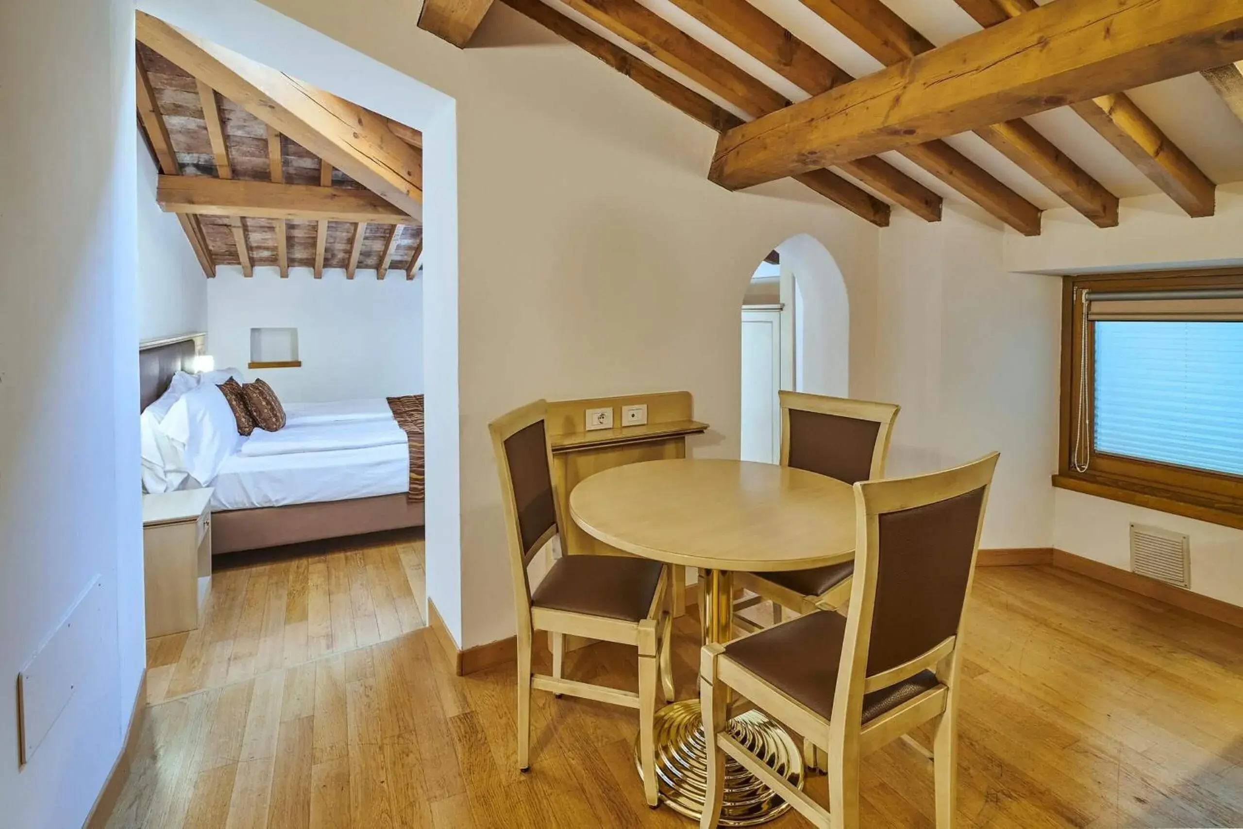 Bedroom, Dining Area in Hotel Portici - Romantik & Wellness