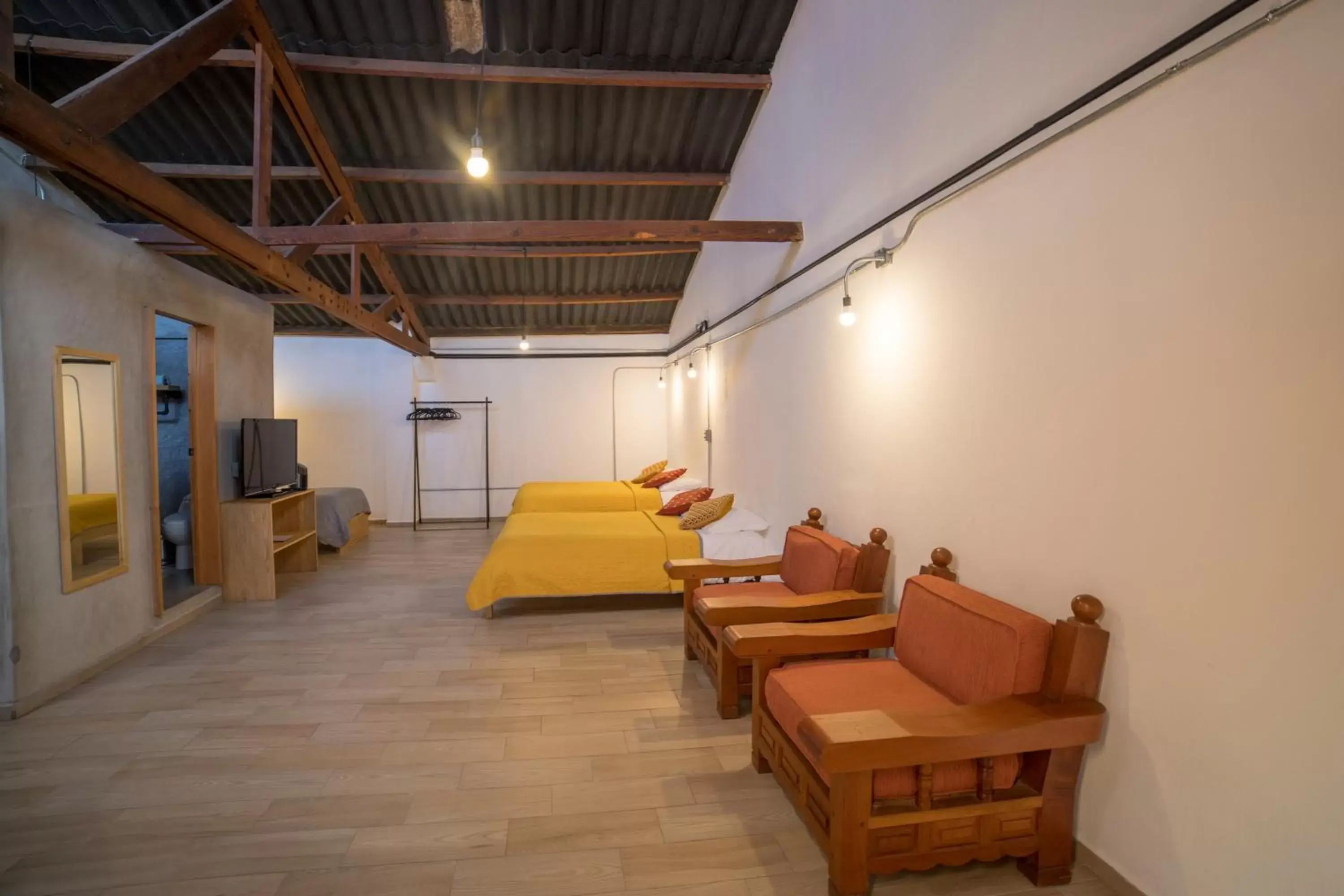 Bed, Seating Area in Ixmukané Suites & Spa