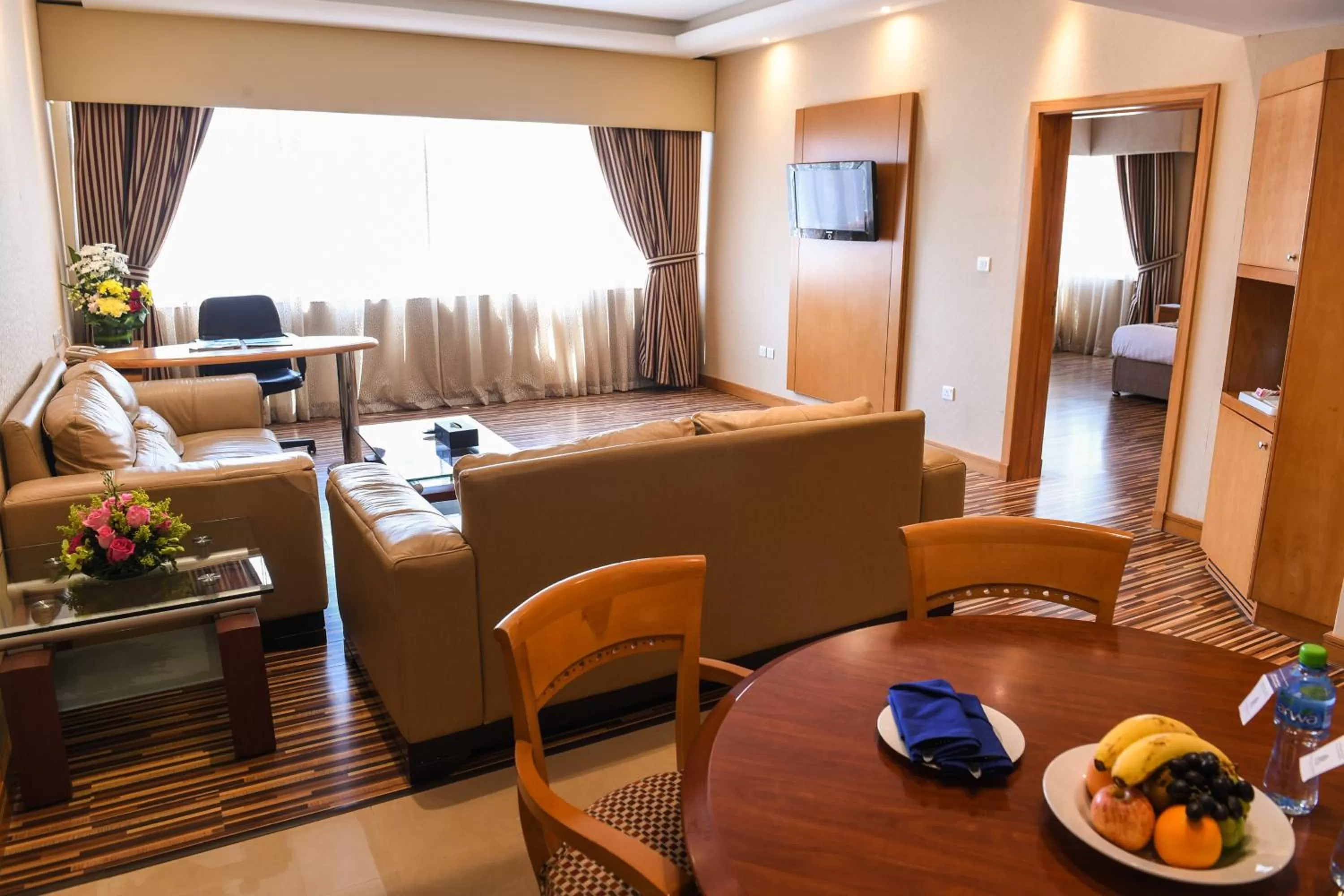 Seating area, Bed in Juffair Grand Hotel