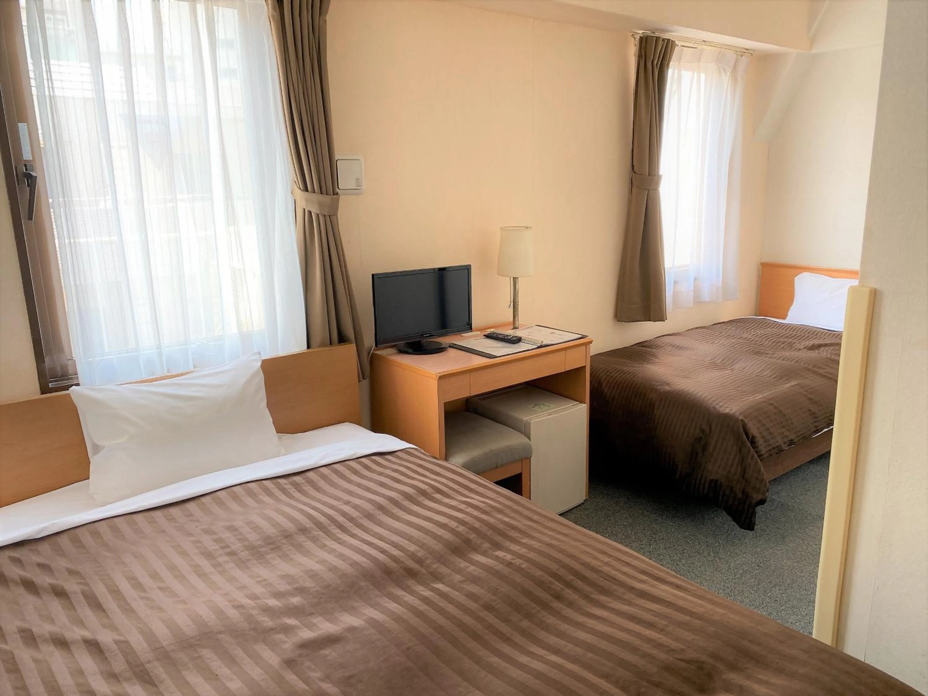 Bed in Sakura Hotel Hatagaya