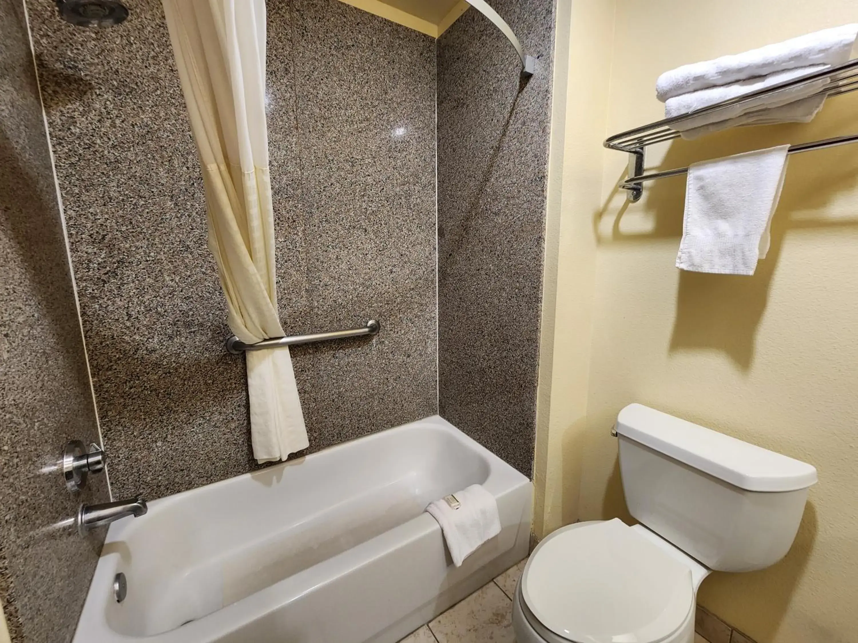Bathroom in Days Inn & Suites by Wyndham Sam Houston Tollway