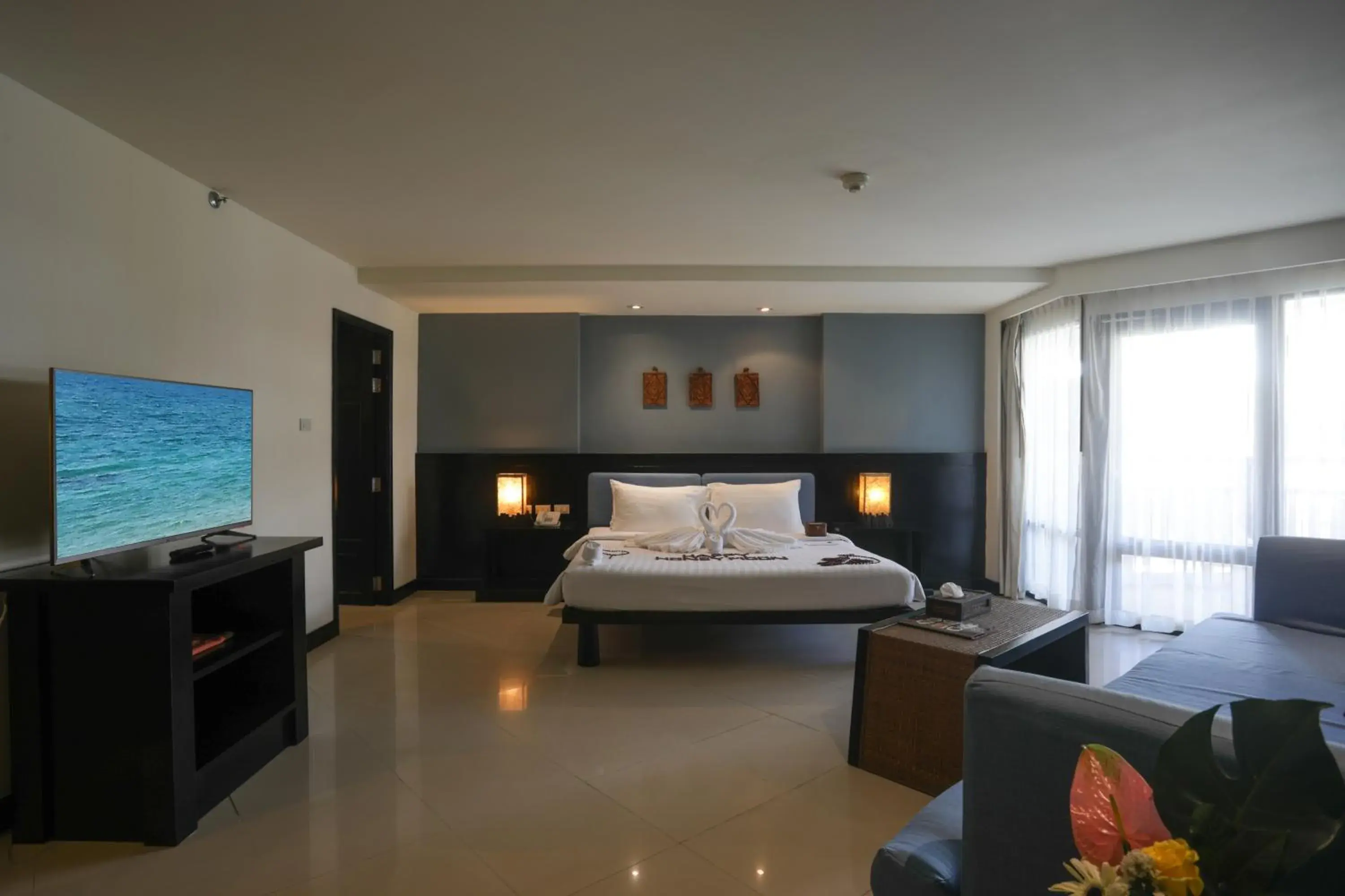 Pool view, Bed in Woraburi Phuket Resort & Spa - SHA Plus Pool view, Bed in Woraburi Phuket Resort & Spa - SHA Plus