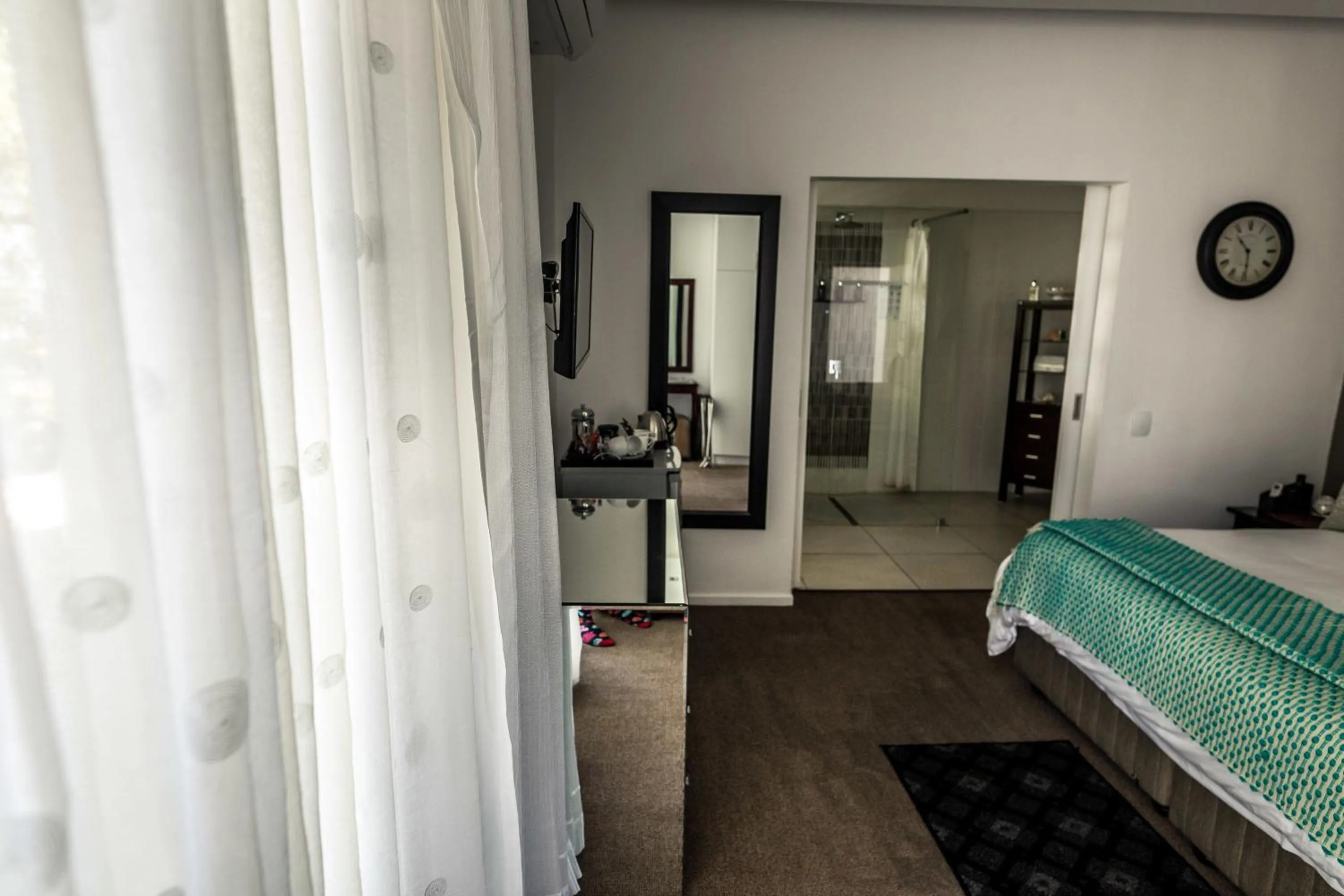 Bed in Point B Guest House -Sustainable Solar Energy