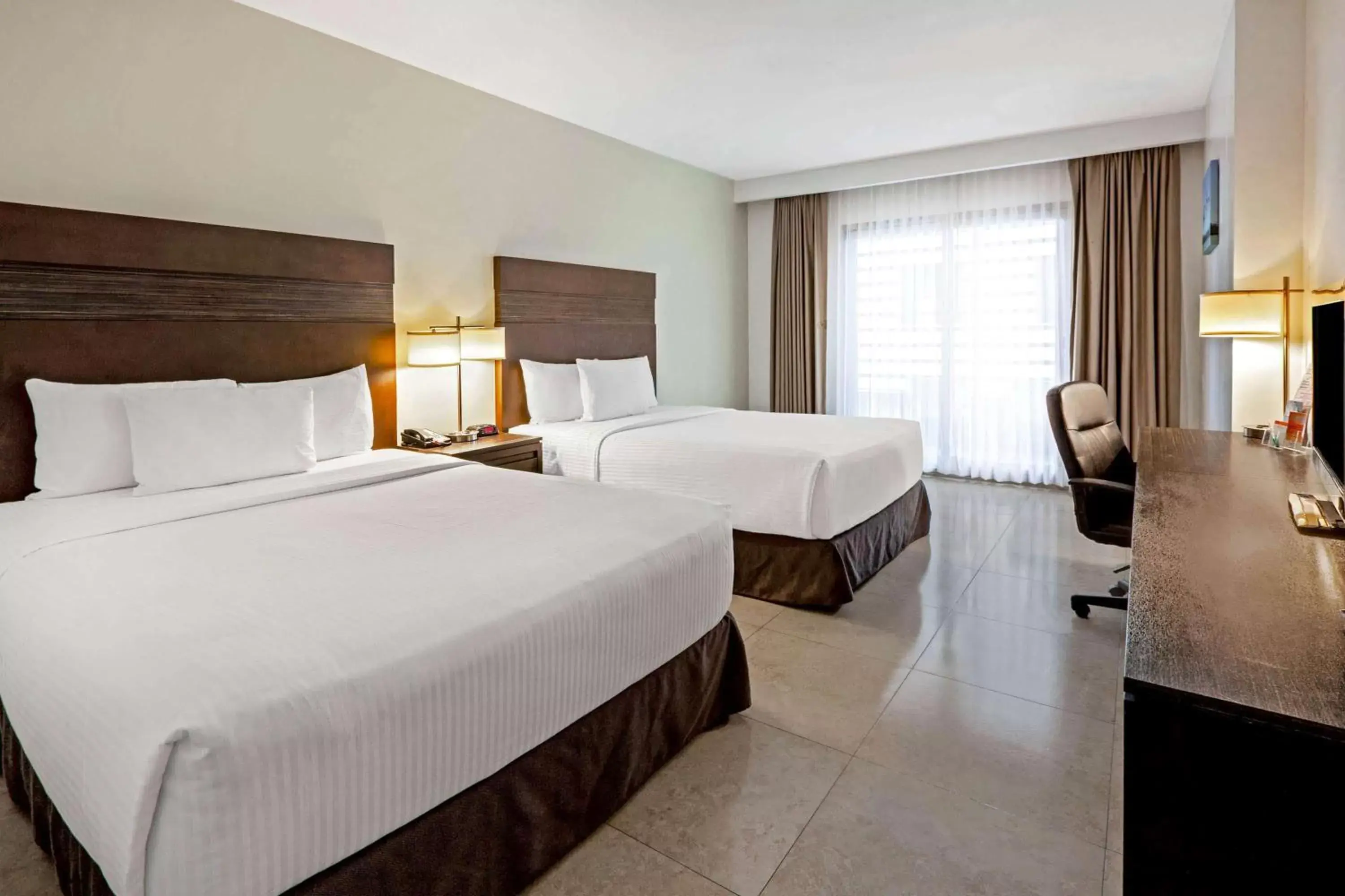 Photo of the whole room, Bed in Wyndham Garden Cancun Downtown