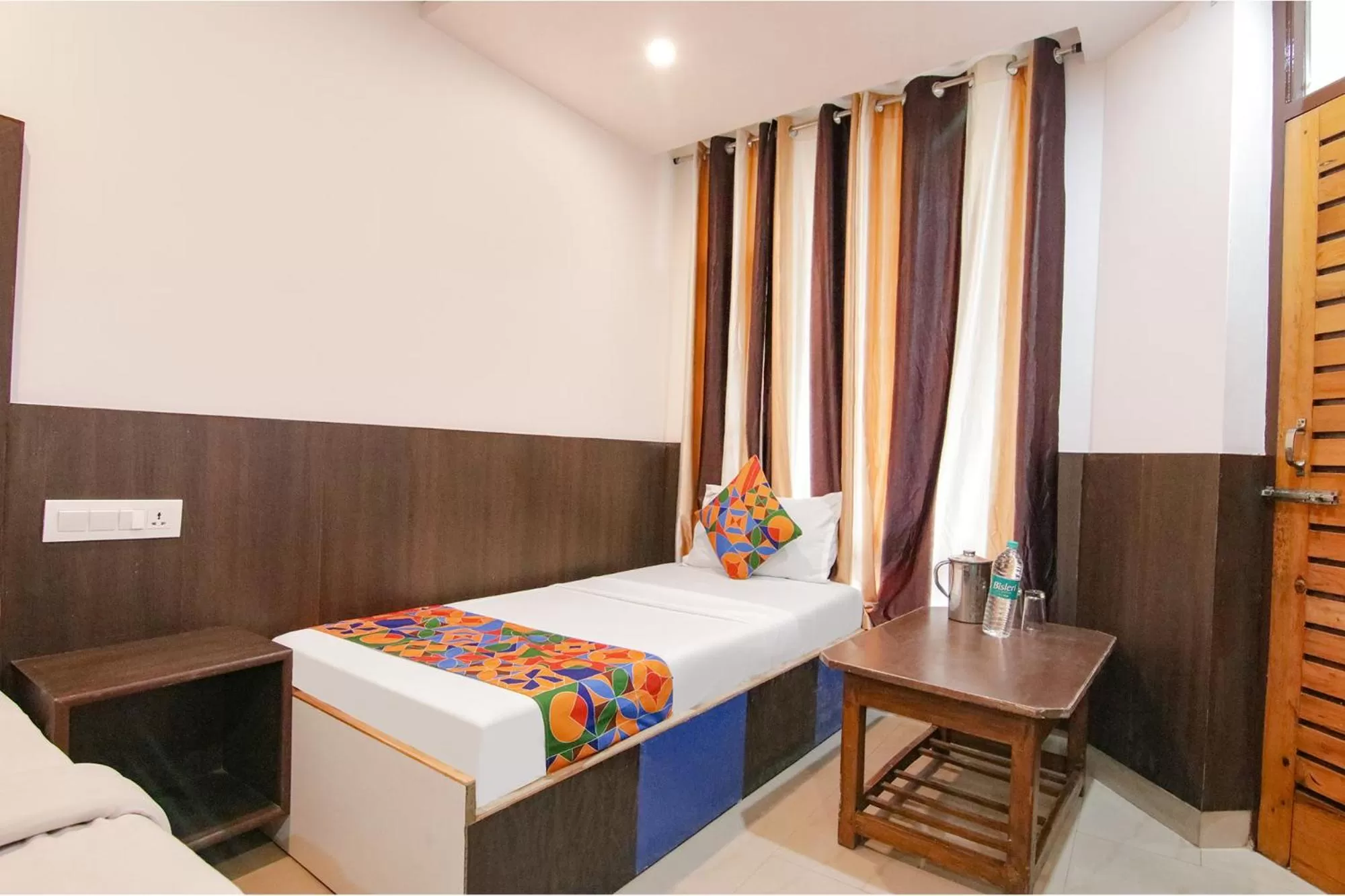 Bed in FabHotel Rosewood Inn I