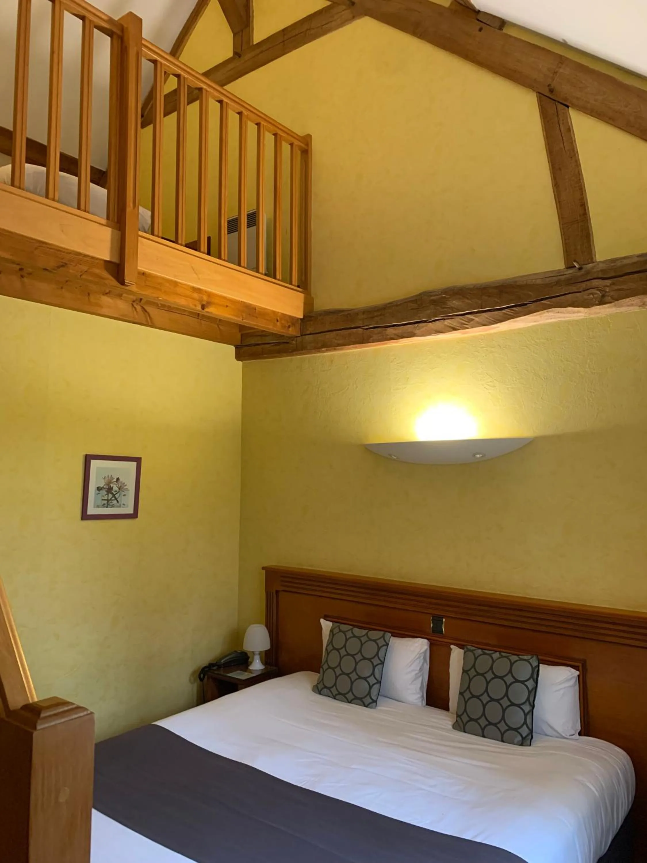 Bed in Logis Hôtel Restaurant Le Moulin de la Coudre