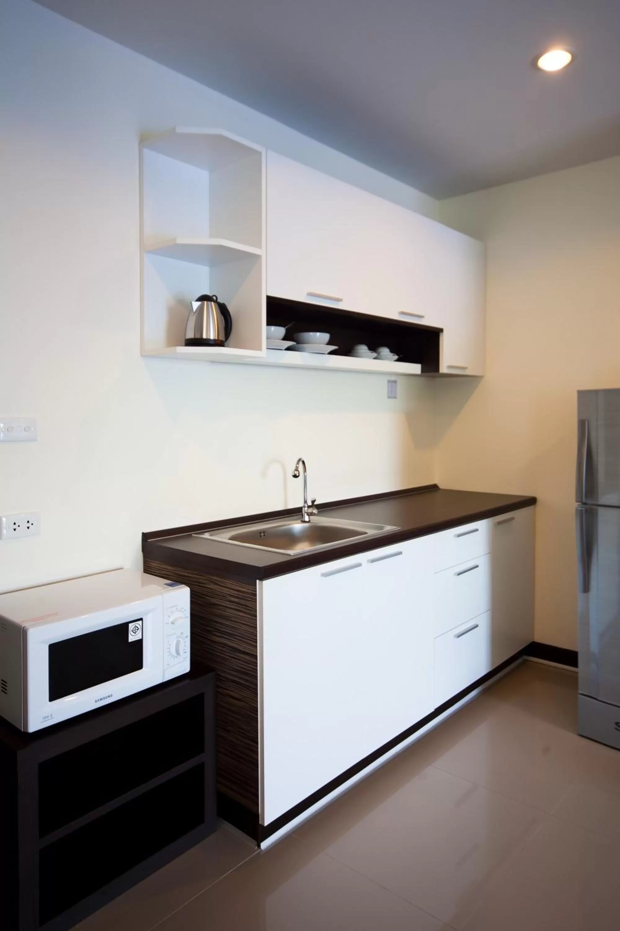Kitchen or kitchenette in Phavina Hotel Rayong SHA Extra Plus