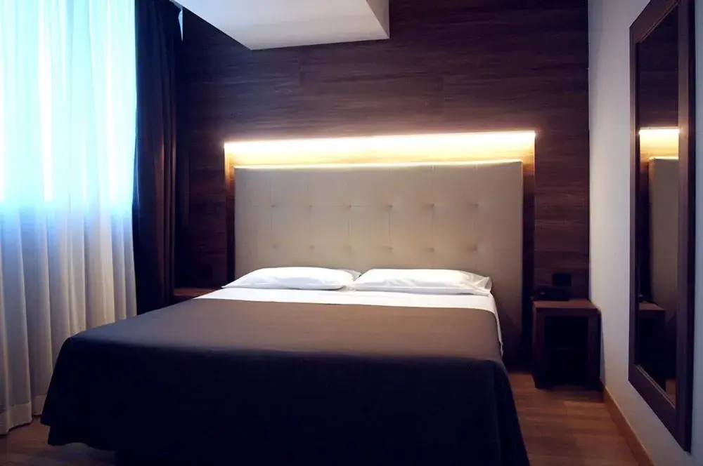 Bed in Golf Hotel Milano