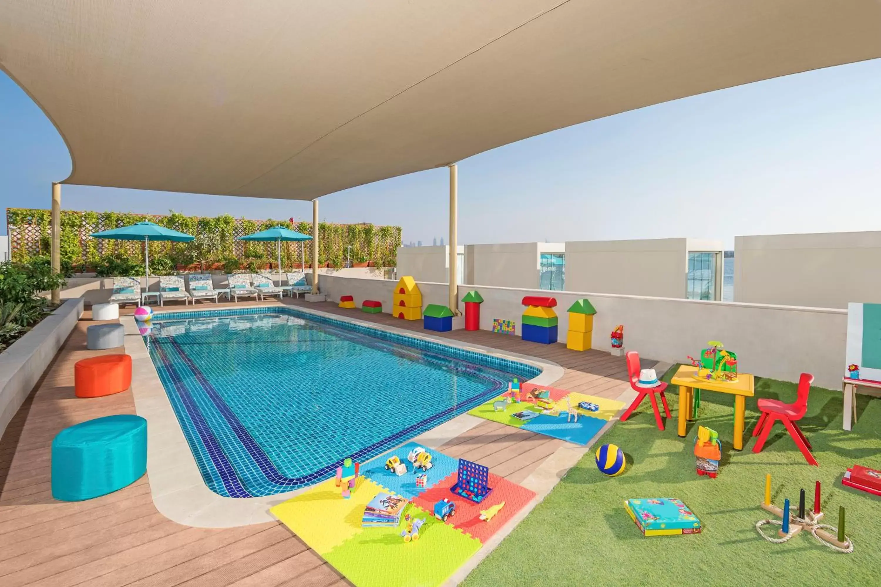Children play ground, Swimming Pool in The Retreat Palm Dubai MGallery by Sofitel