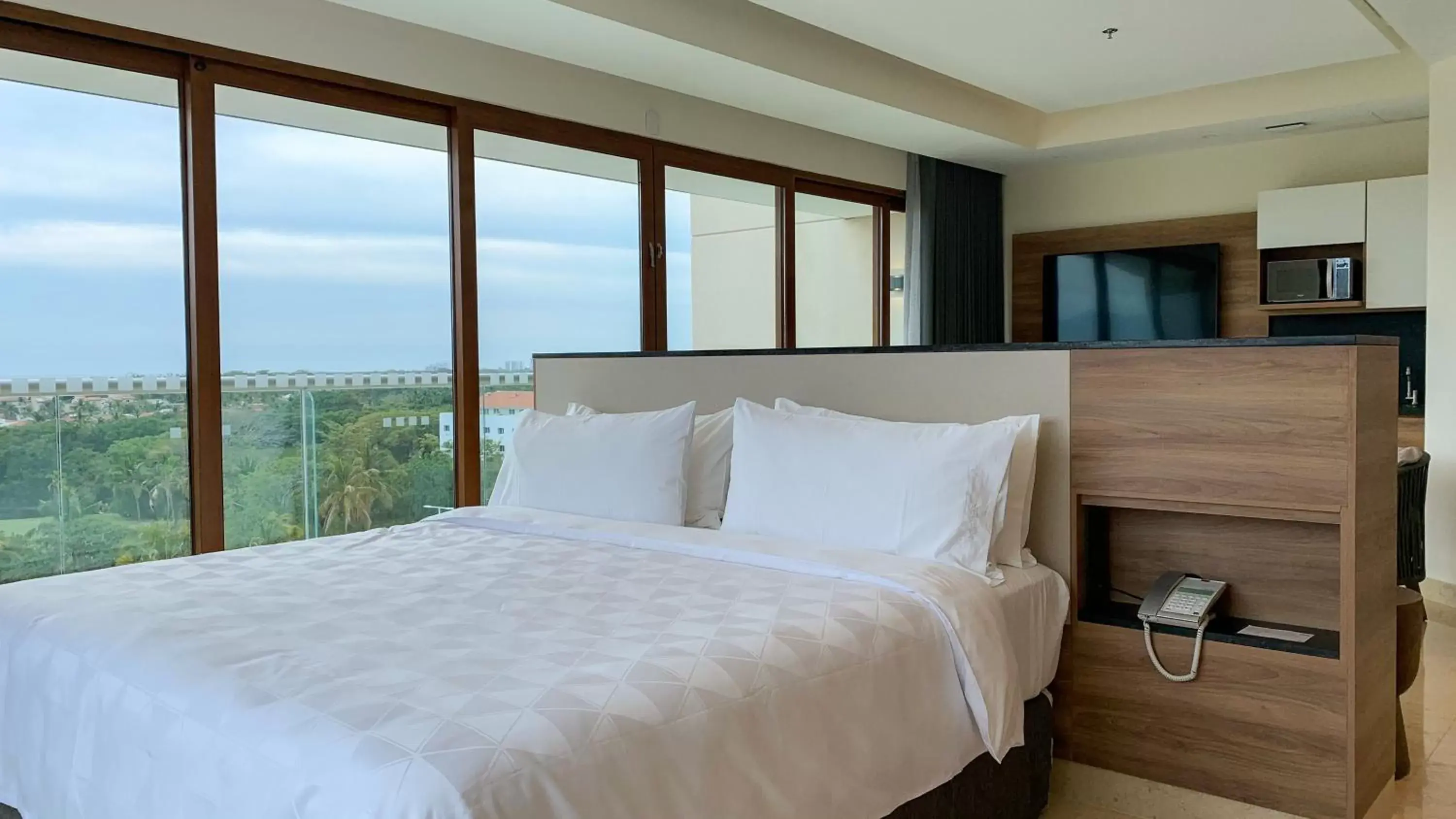 Photo of the whole room, Bed in Holiday Inn & Suites - Puerto Vallarta Marina & Golf, an IHG Hotel