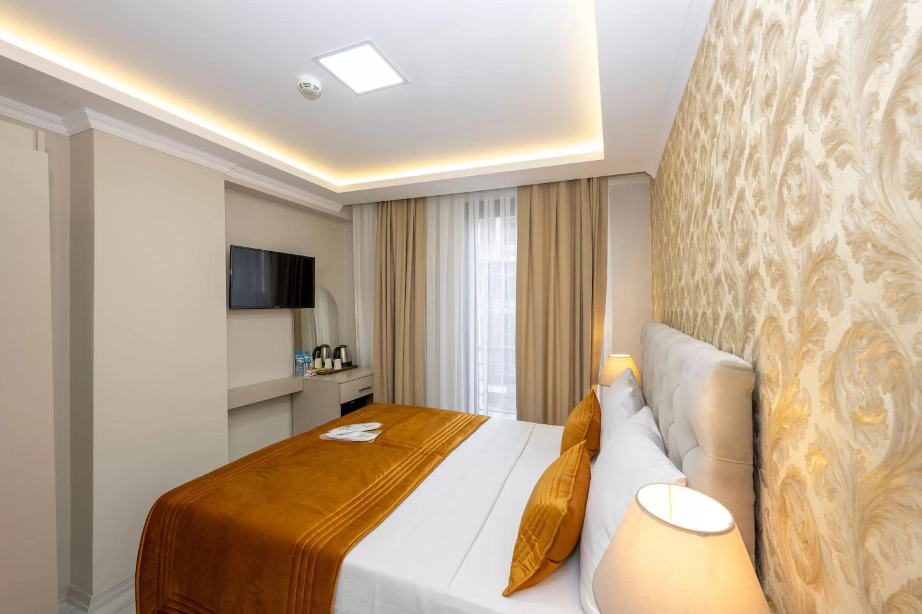 Bed in SKYSTAR DELUXE HOTEL