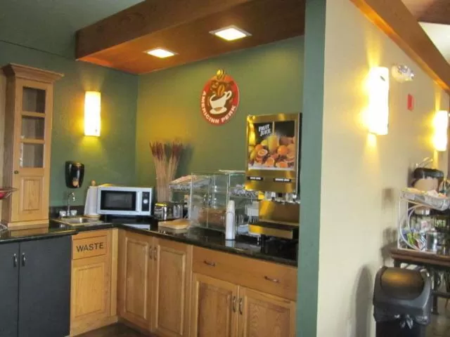 Kitchen or kitchenette in AmericInn by Wyndham West Bend