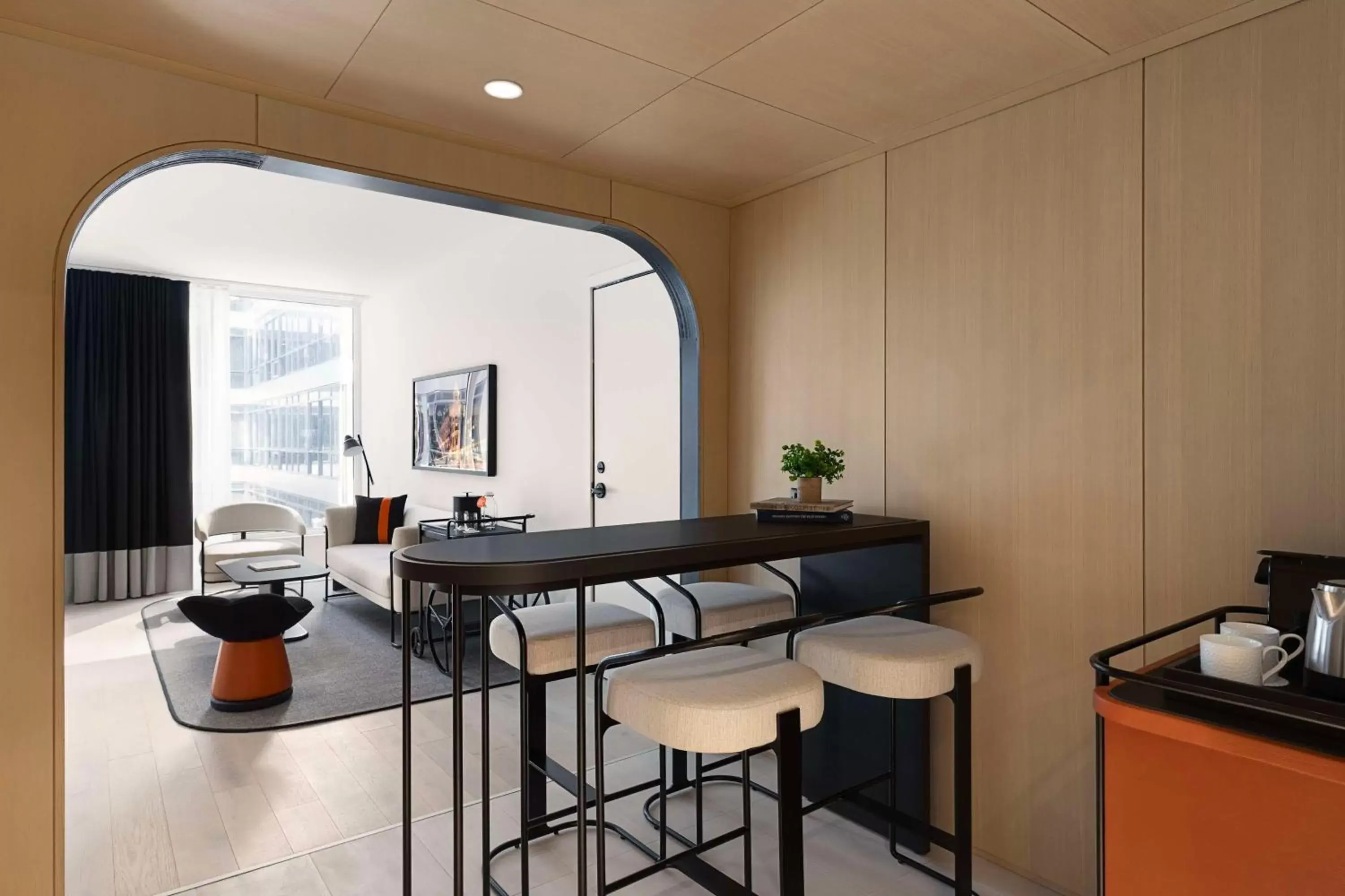 Living room, Kitchen/Kitchenette in Canopy By Hilton Toronto Yorkville