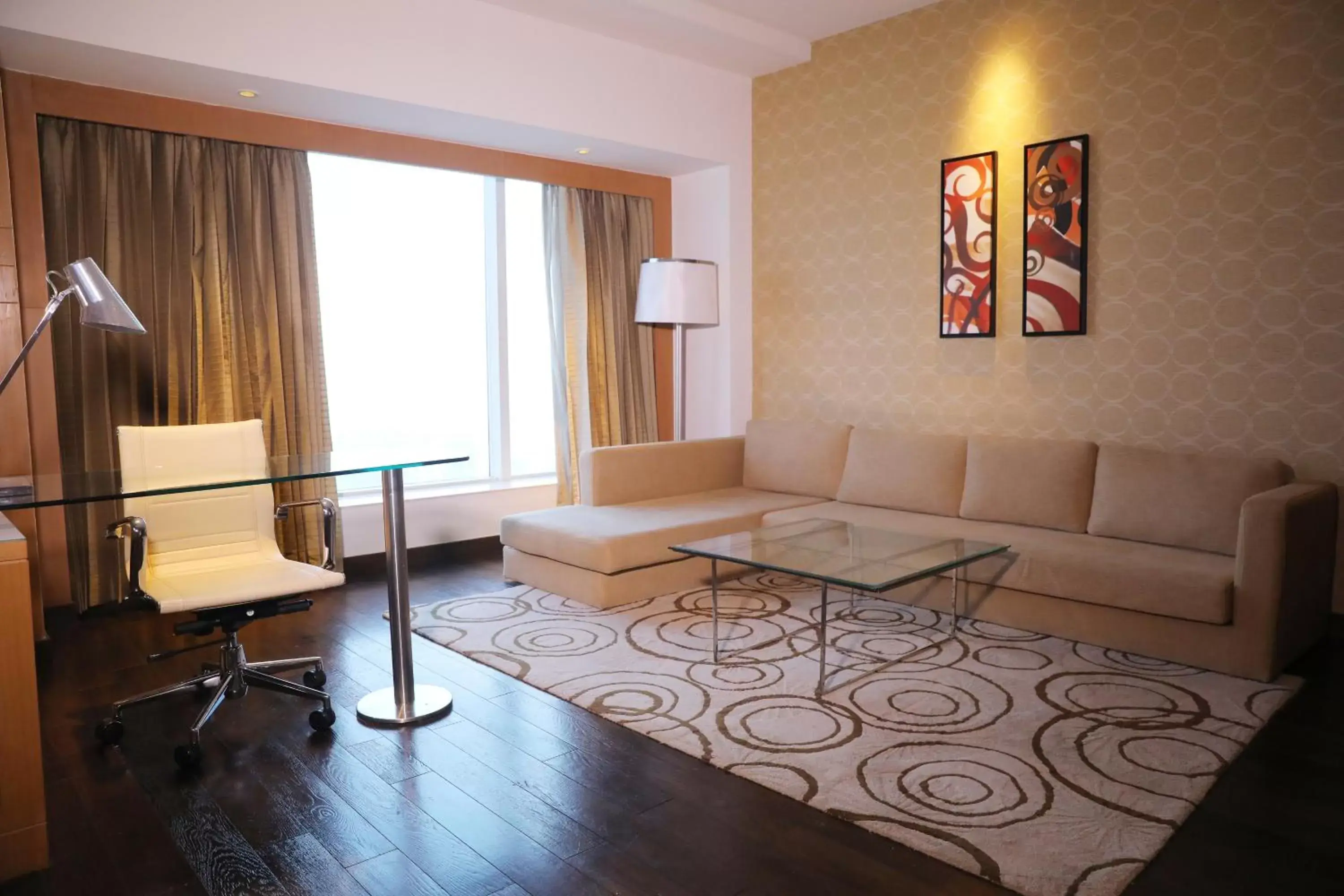 TV and multimedia, Seating Area in Crowne Plaza Greater Noida, an IHG Hotel