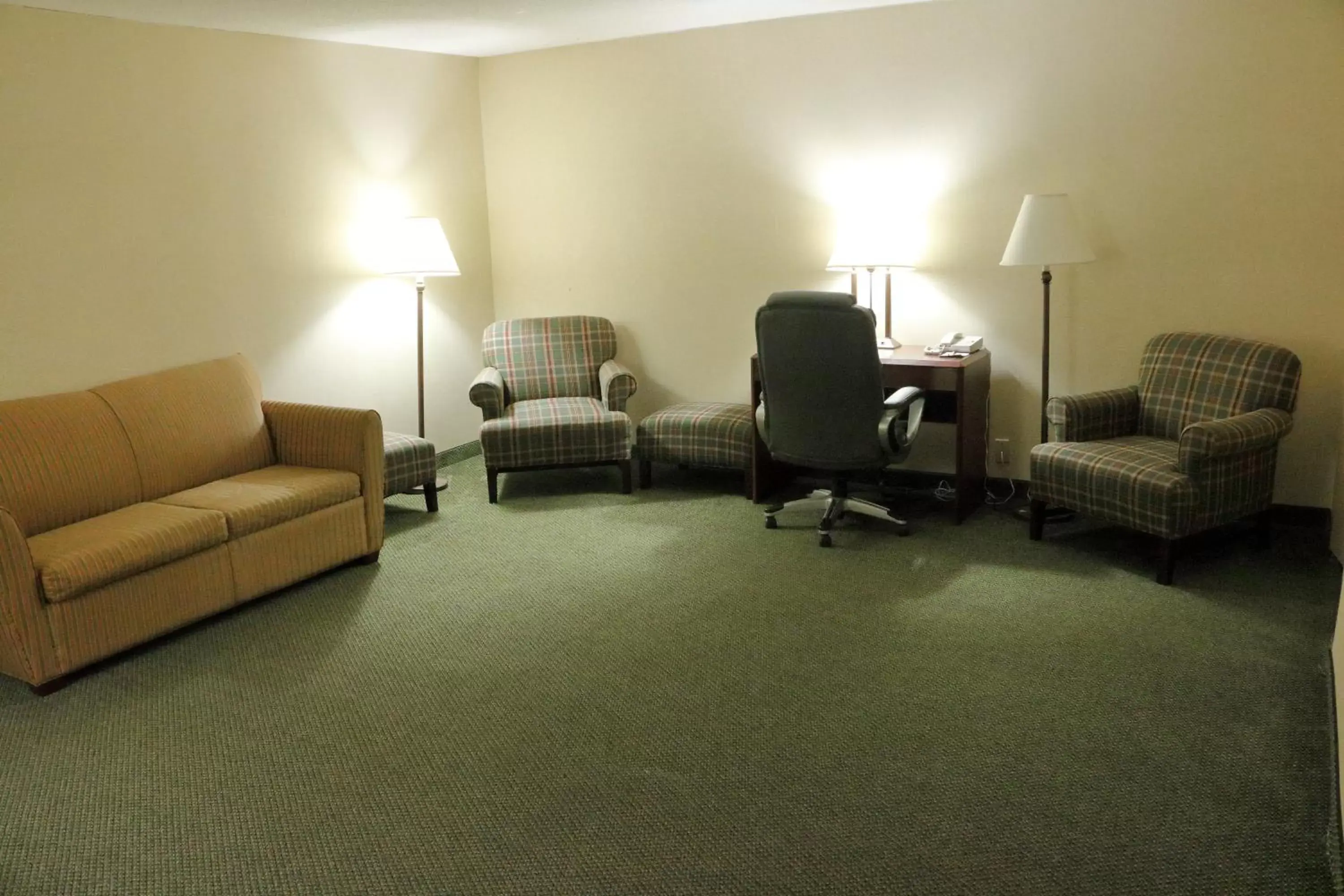 Photo of the whole room, Seating Area in Ramada by Wyndham Alpena