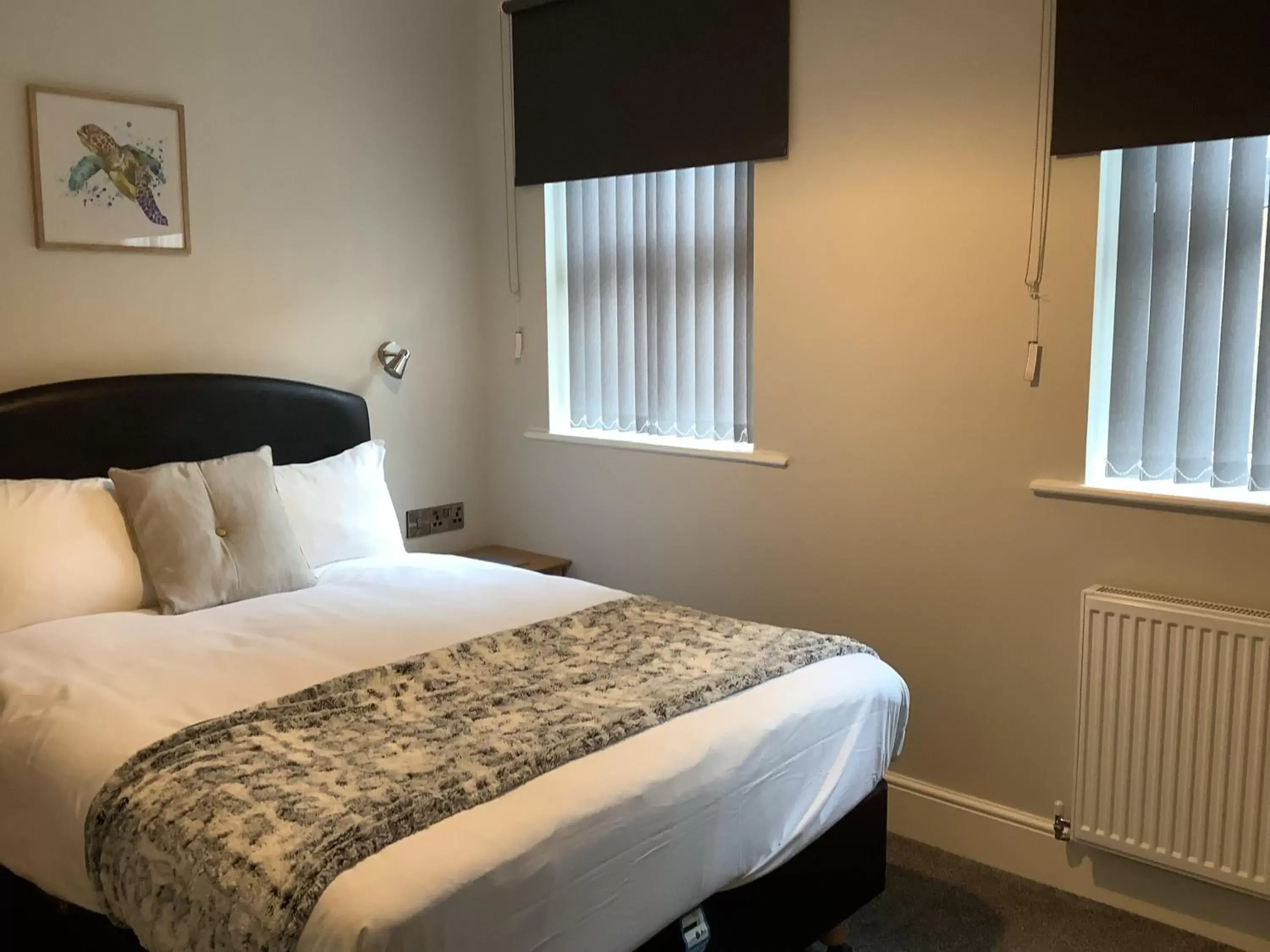 Bed in Jeffersons Hotel & Serviced Apartments