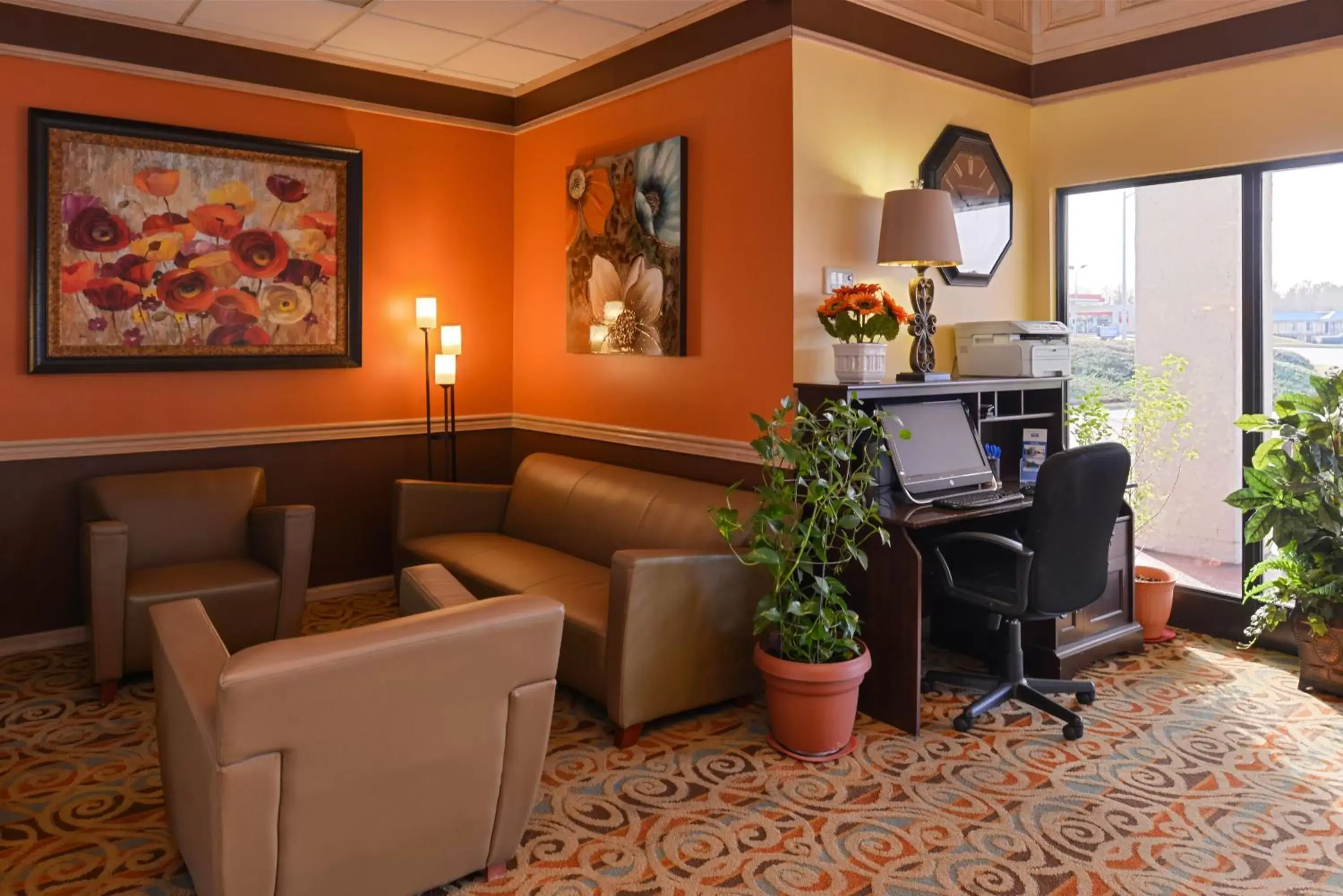 Communal lounge/ TV room in SureStay Plus Hotel by Best Western Fayetteville