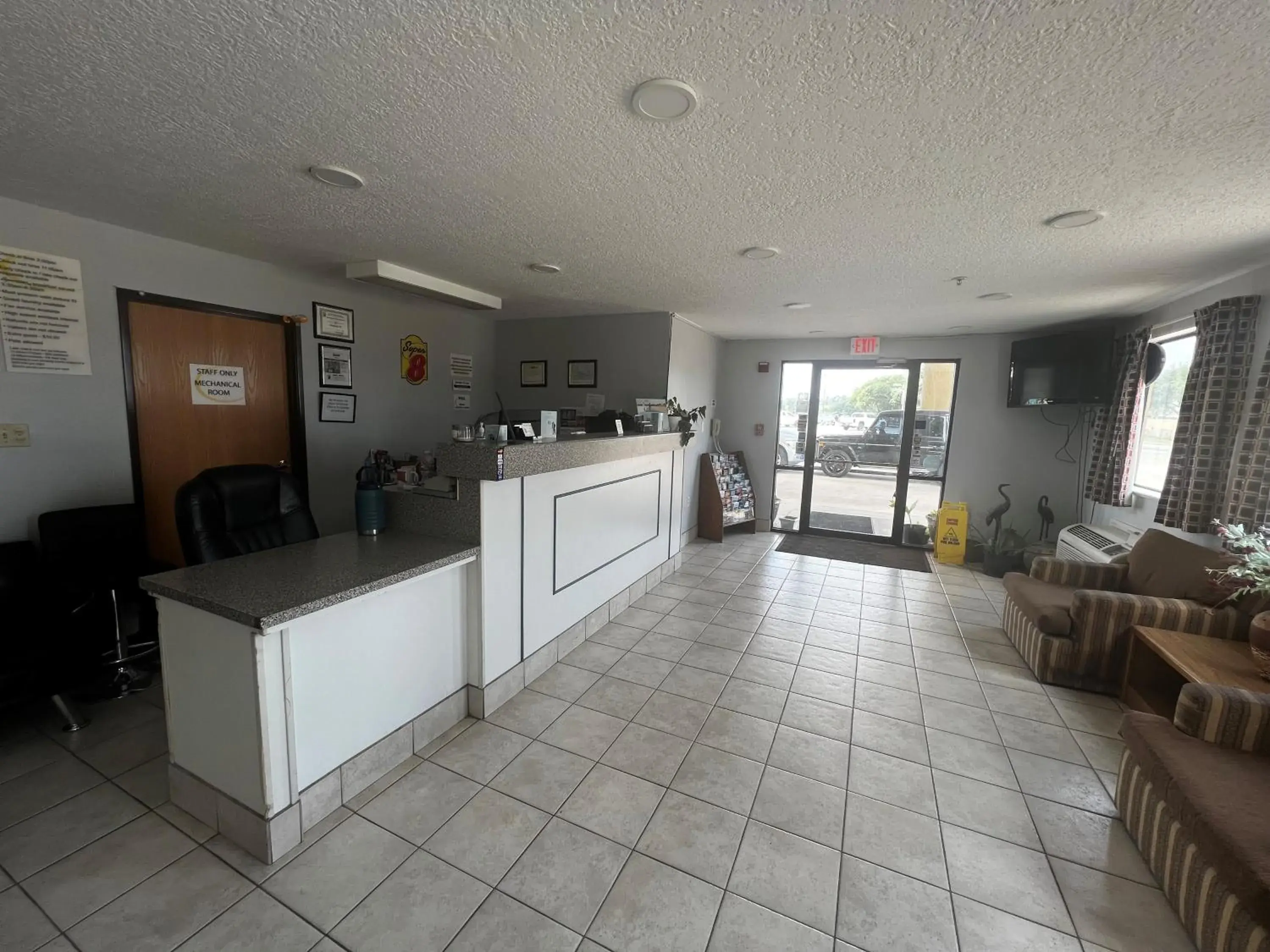 Lobby or reception in Super 8 by Wyndham Cleveland TX Lobby or reception in Super 8 by Wyndham Cleveland TX