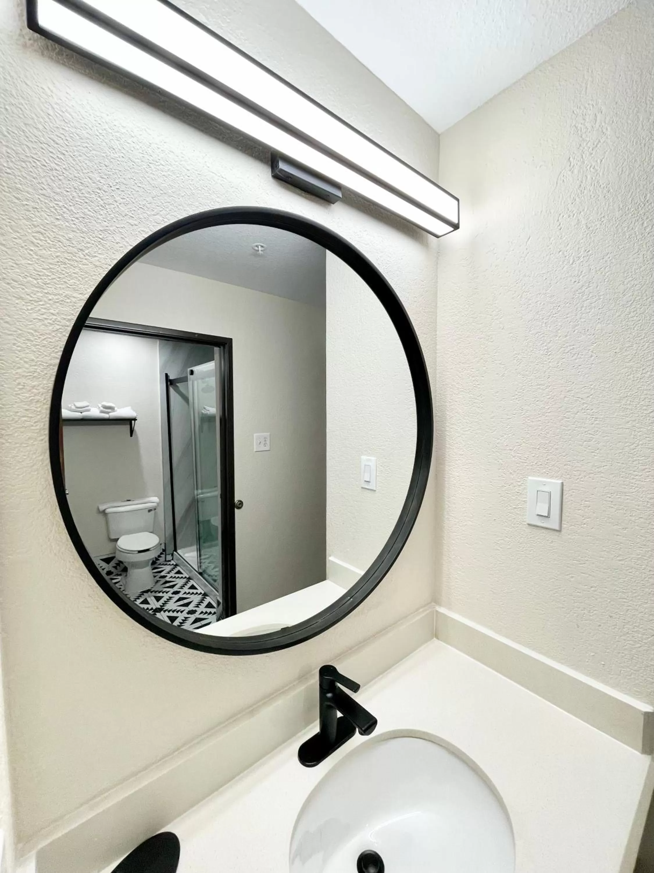 Bathroom in Days Inn by Wyndham Arlington