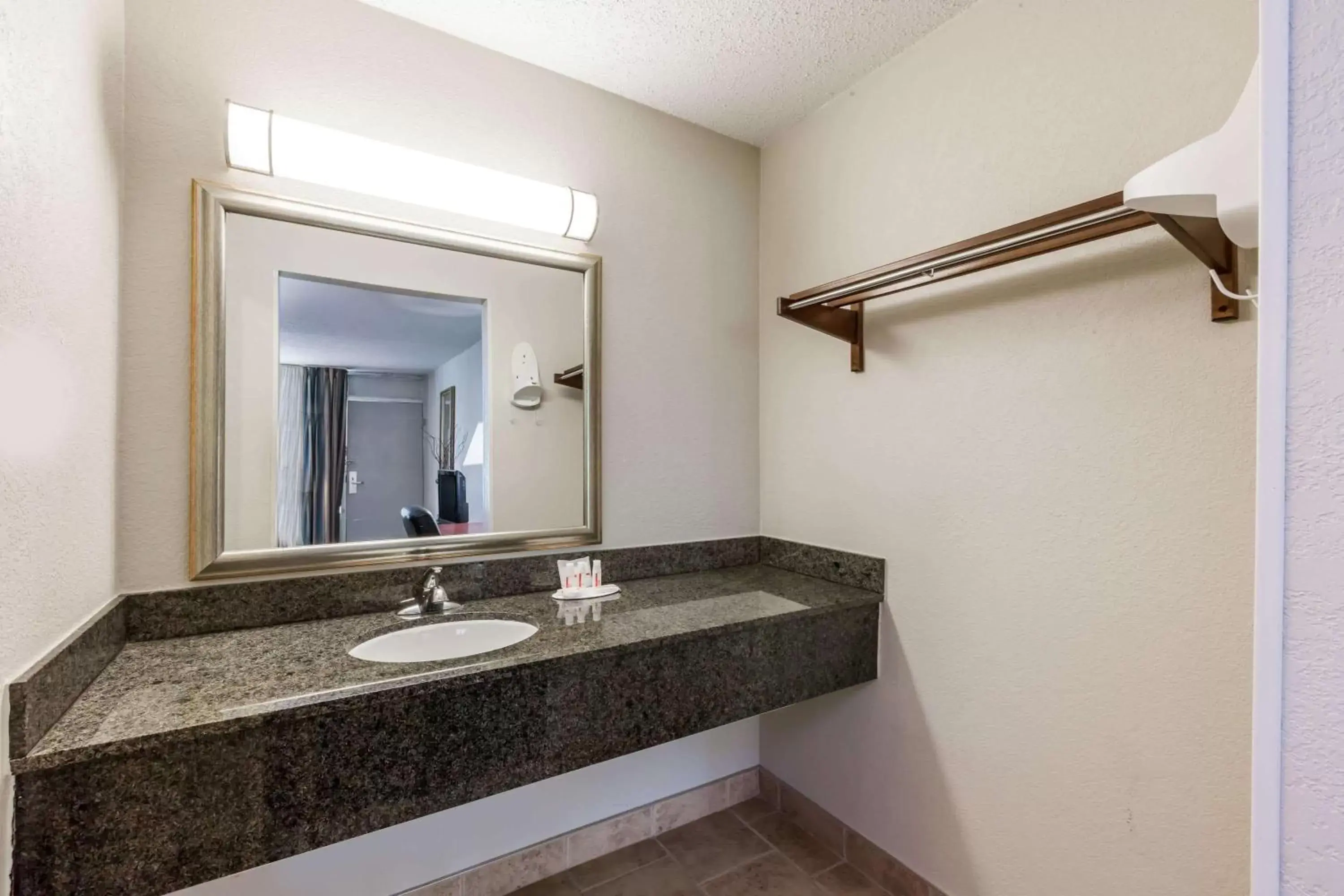 Bathroom in Ramada by Wyndham New Iberia