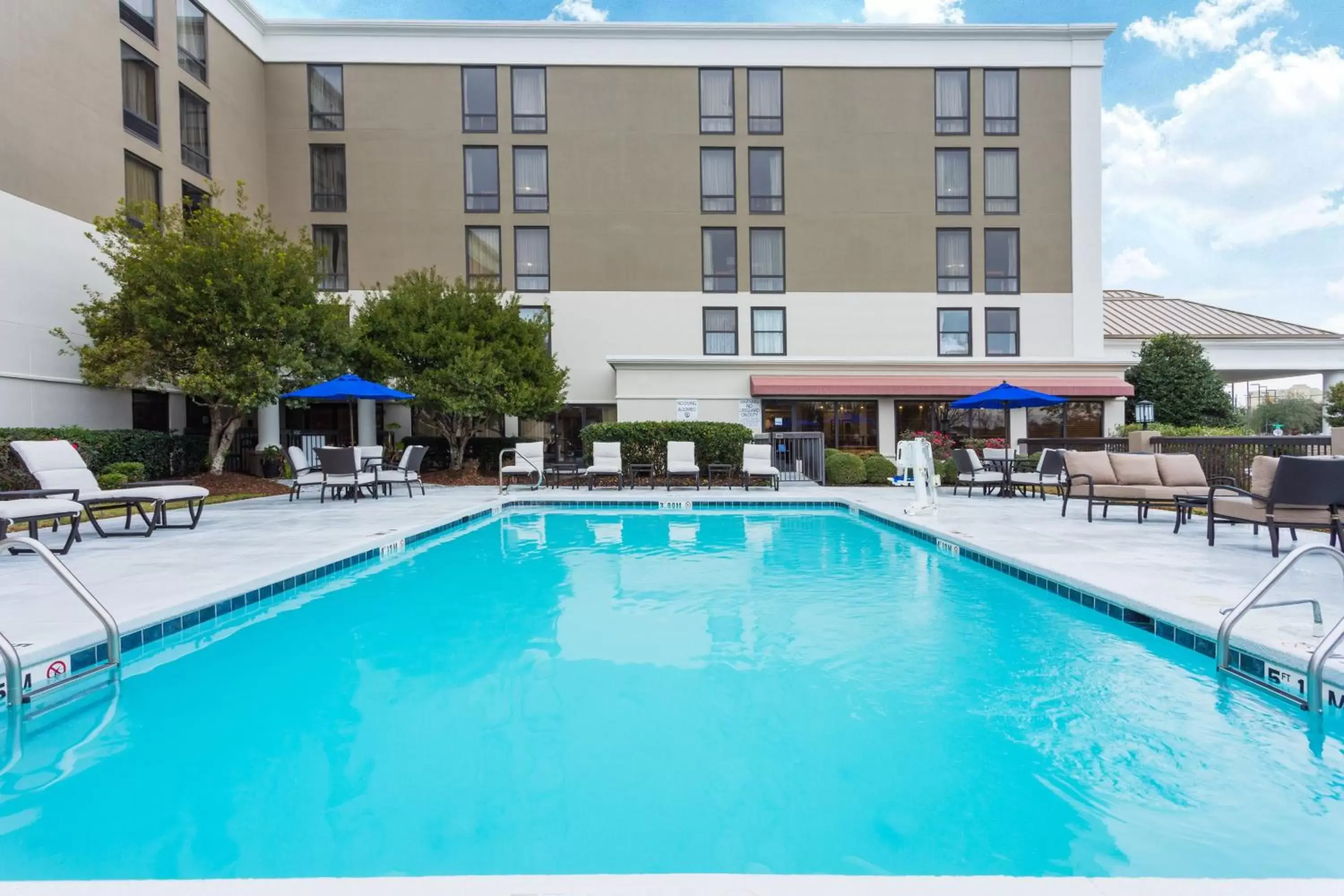 Swimming Pool in Holiday Inn Express & Suites Wilmington-University Center, an IHG Hotel